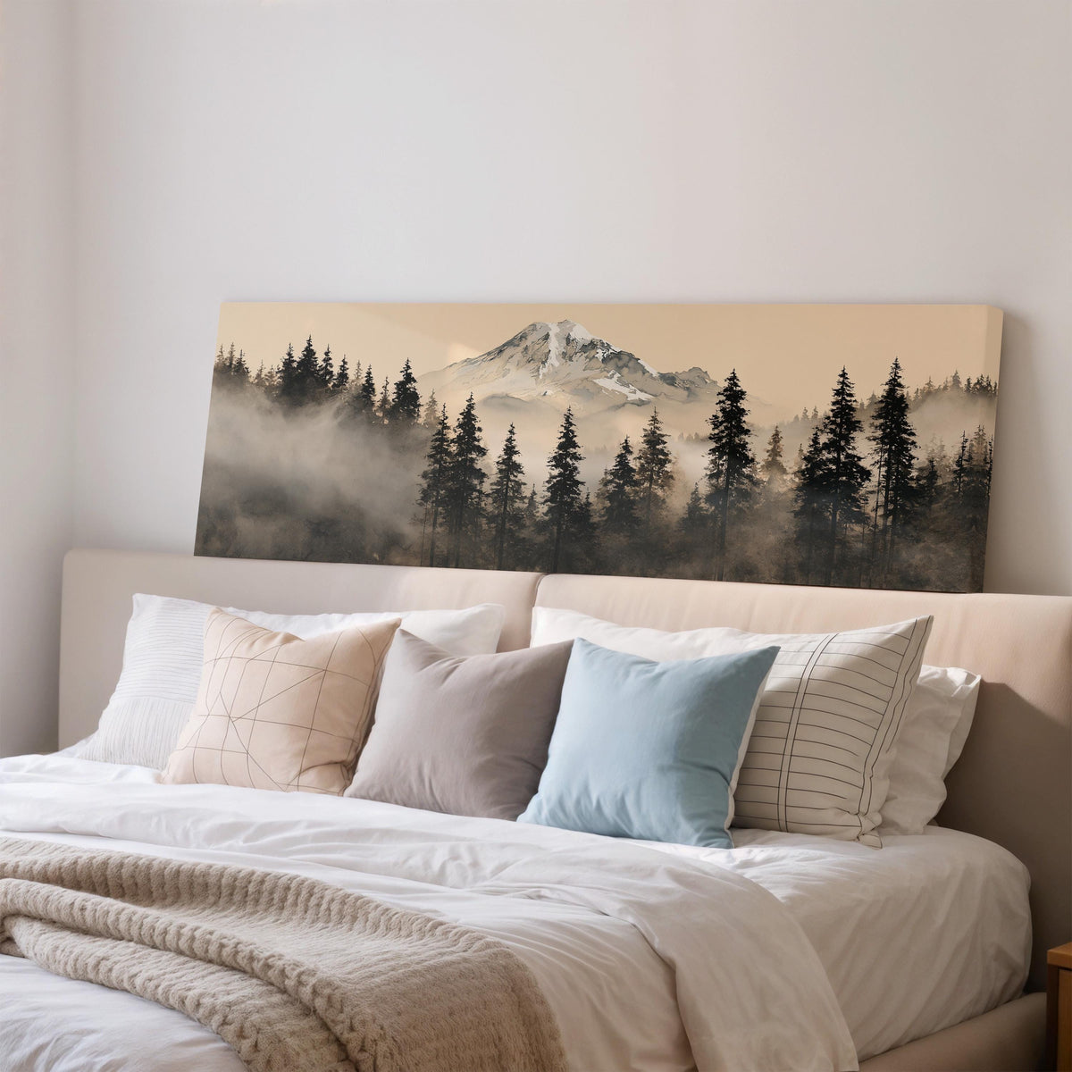 Foggy pine forest below a snowy mountain wide panoramic canvas print above a bed in a bedroom