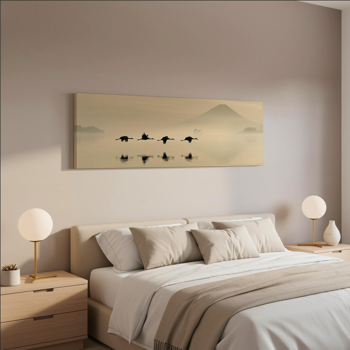Birds flying low over a lake below Mount Fuji wide panoramic canvas print above a bed in a neutral bedroom