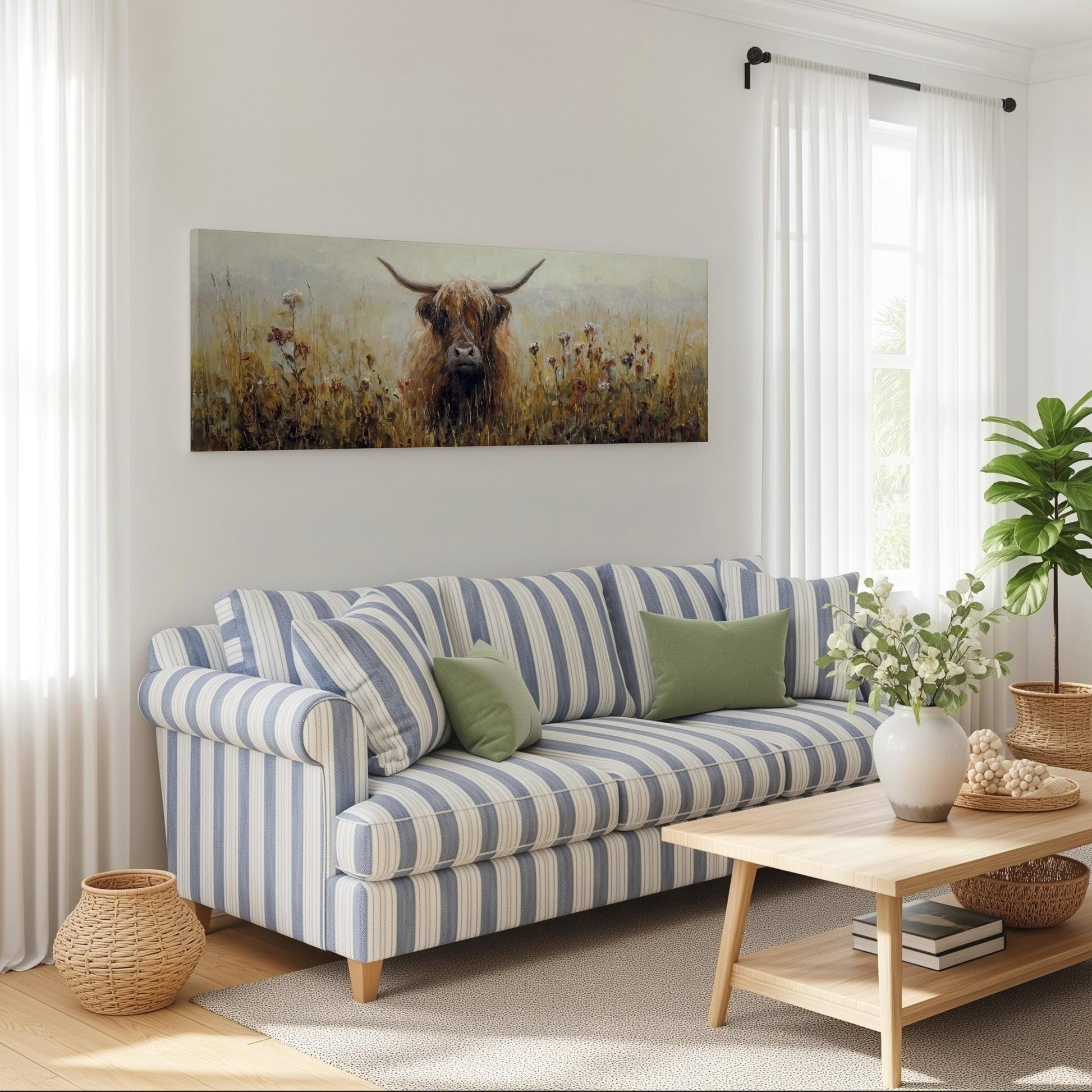 a living room with a blue and white striped sofa, a wooden coffee table, and a large painting of a Highland cow on the wall.
