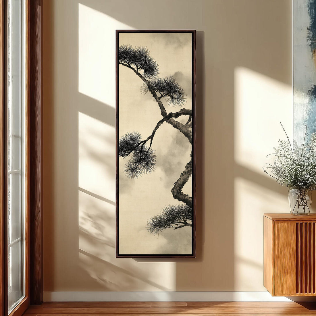 Ink pine branch in mist long vertical canvas print in a sunlit living space