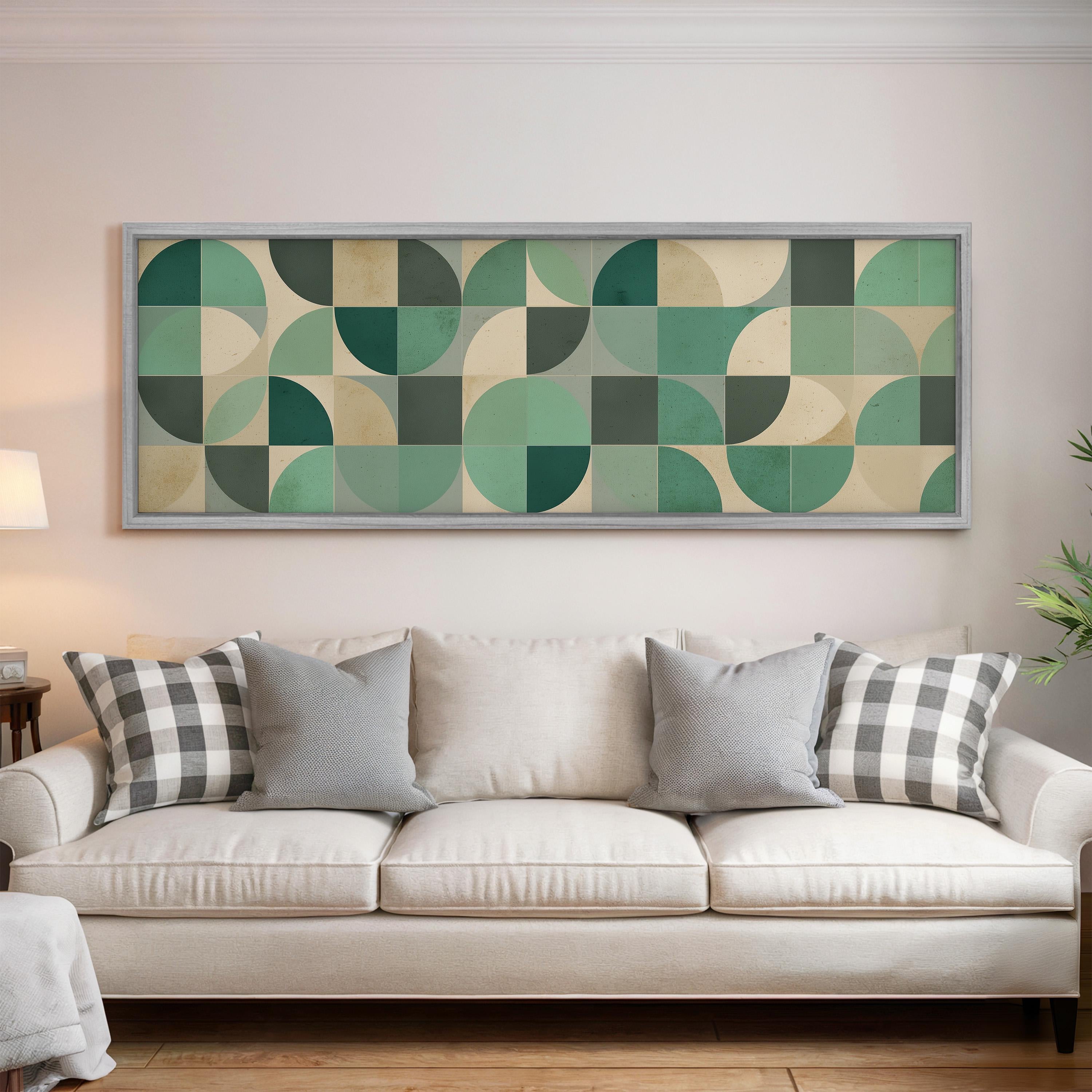 a living room with a white sofa and a large abstract painting hanging on the wall above it.