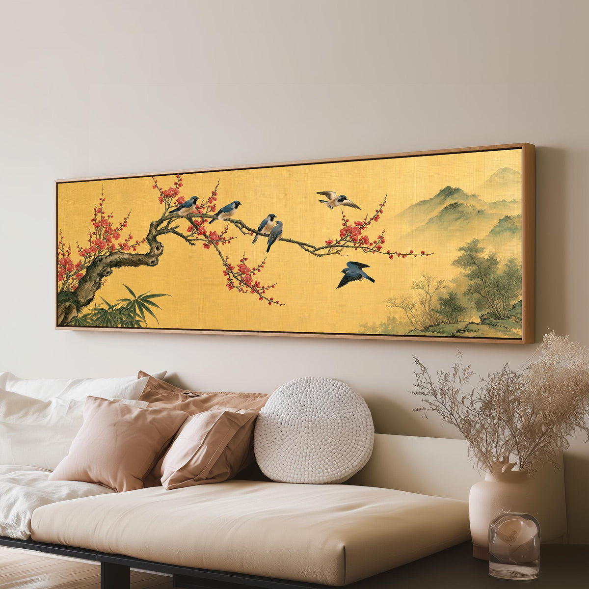 Birds on a plum blossom branch on gold long horizontal canvas print above a sofa in a living room