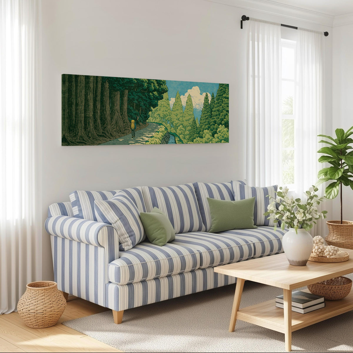 Hiker on a forest trail long horizontal canvas print above a striped sofa in a coastal living room