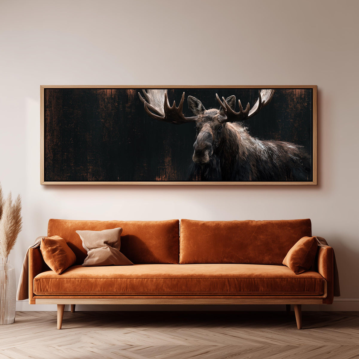 Dark moose portrait panoramic canvas print above a sofa in a living room