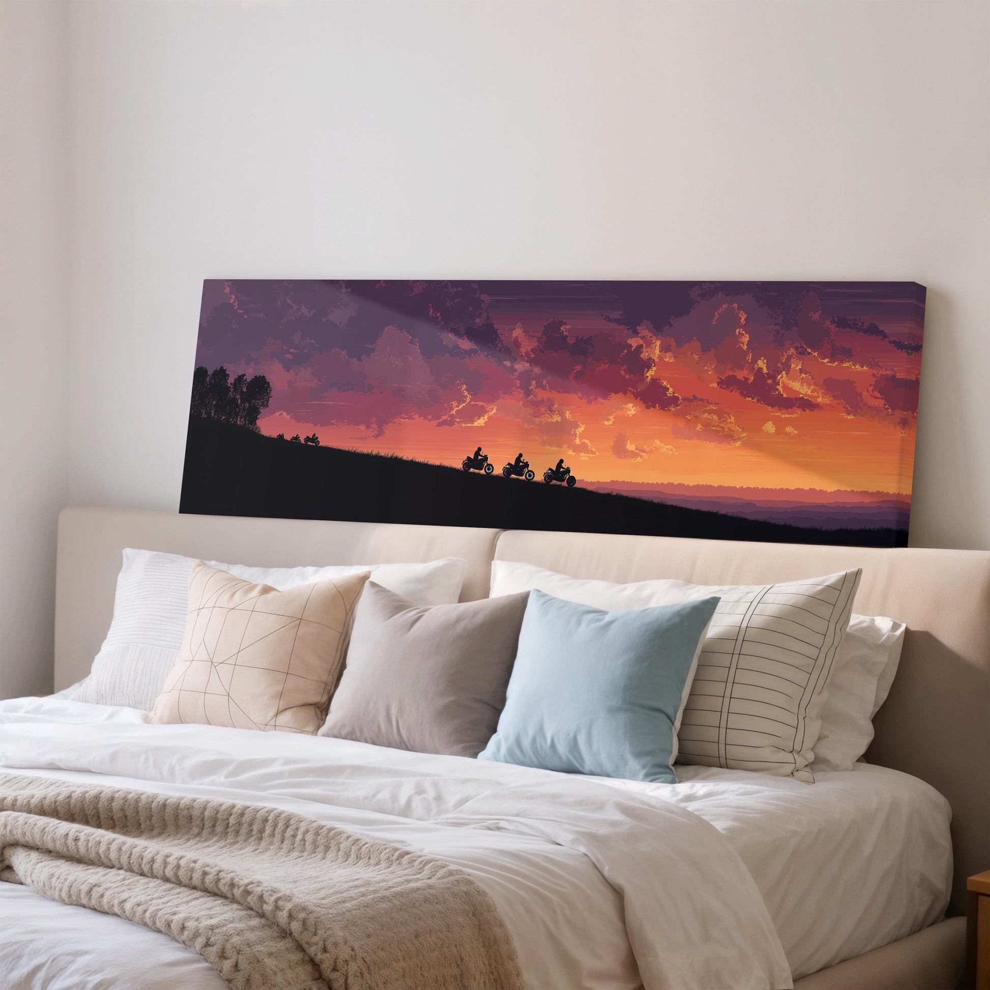 a large bedroom with a bed and a painting of a sunset over a hill.