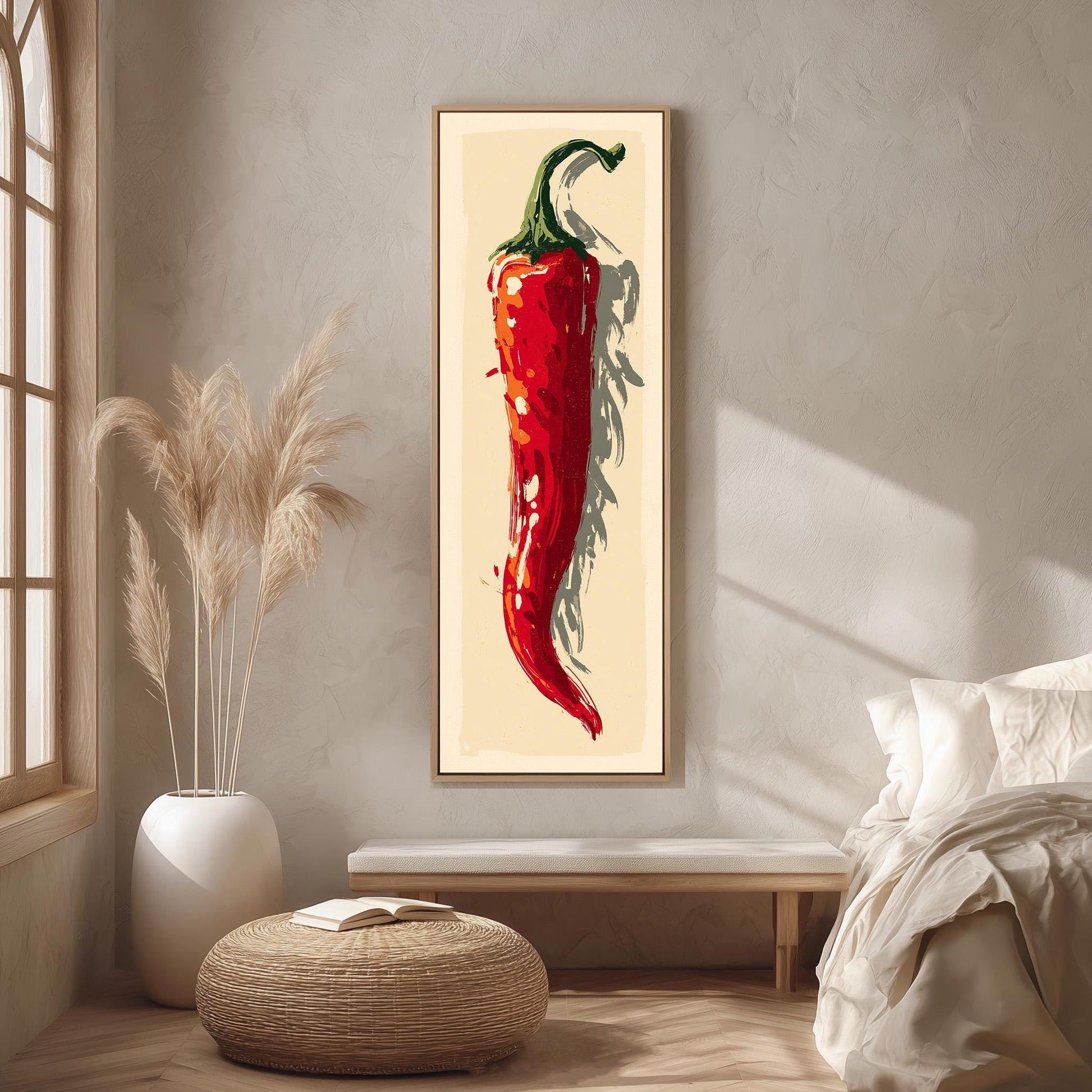 a large framed painting of a red chili pepper hanging on a wall in a room with a bed, a potted plant, and a woven ottoman.
