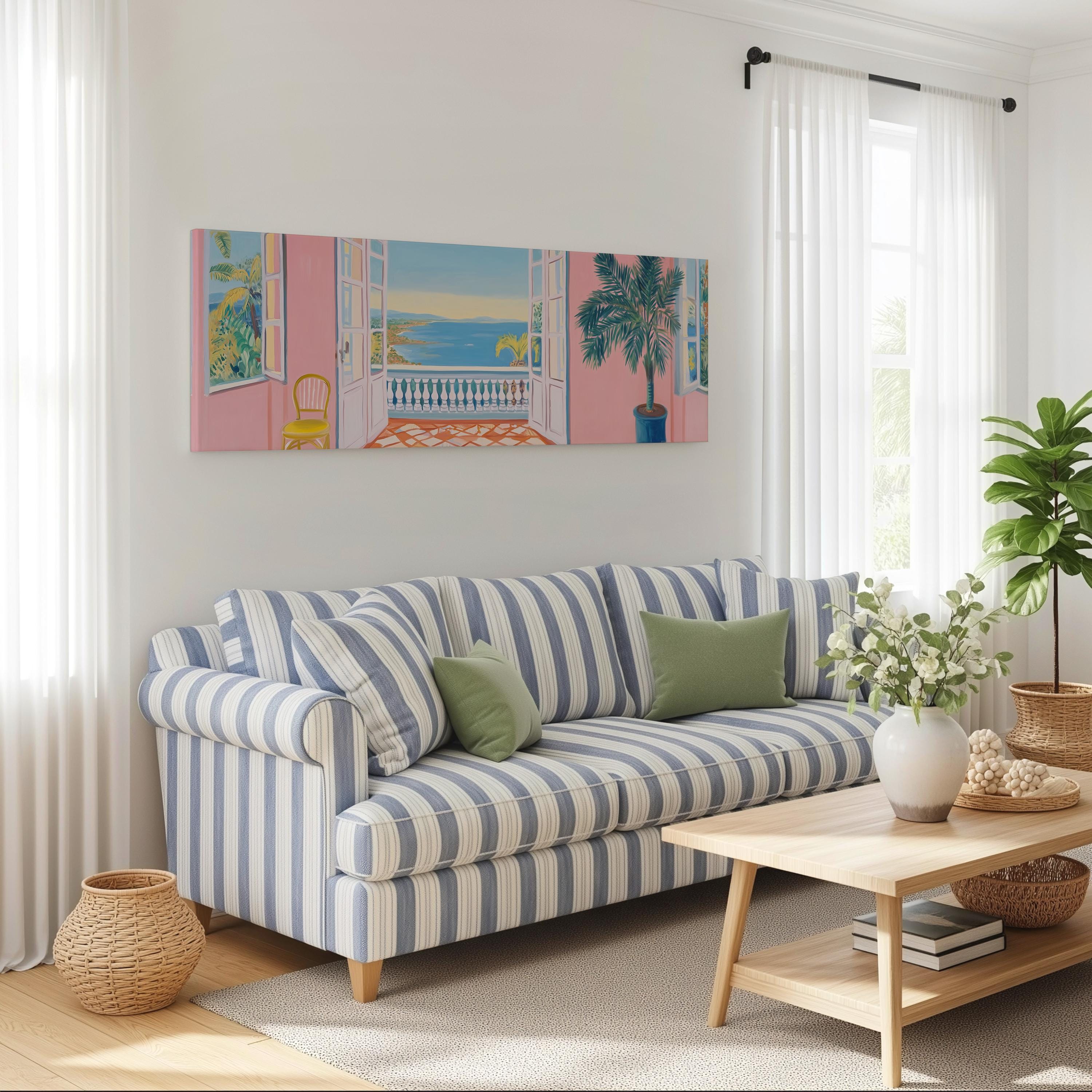 a cozy living room with a striped blue and white sofa, a wooden coffee table, and a large window with white curtains. Above the sofa, there is a large painting of a balcony overlooking the ocean. The room is decorated with potted plants and other home decor items, creating a warm and inviting atmosphere.