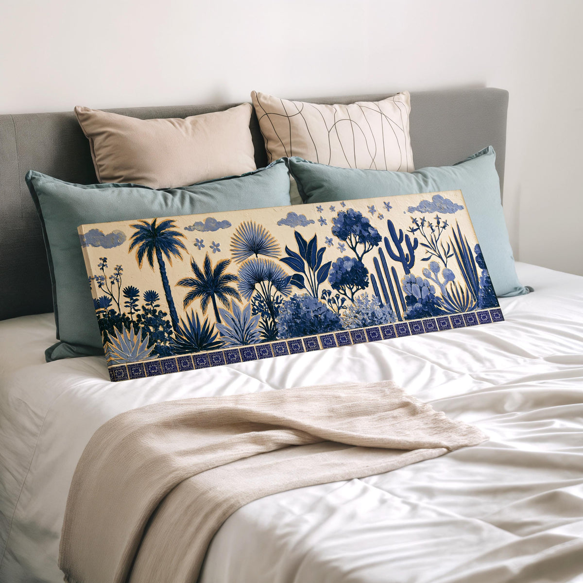 Blue palms, cacti and flowers pattern wide panoramic canvas print laid on a bed to show its size