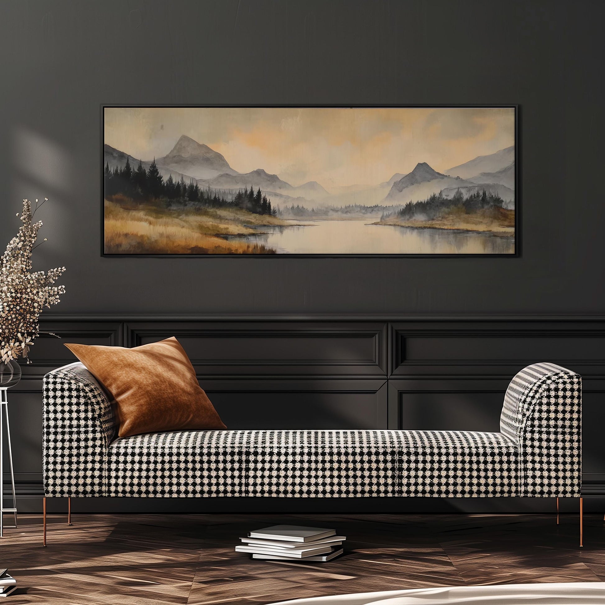 a large landscape painting hanging on a wall above a black and white checkered sofa with a brown throw pillow.