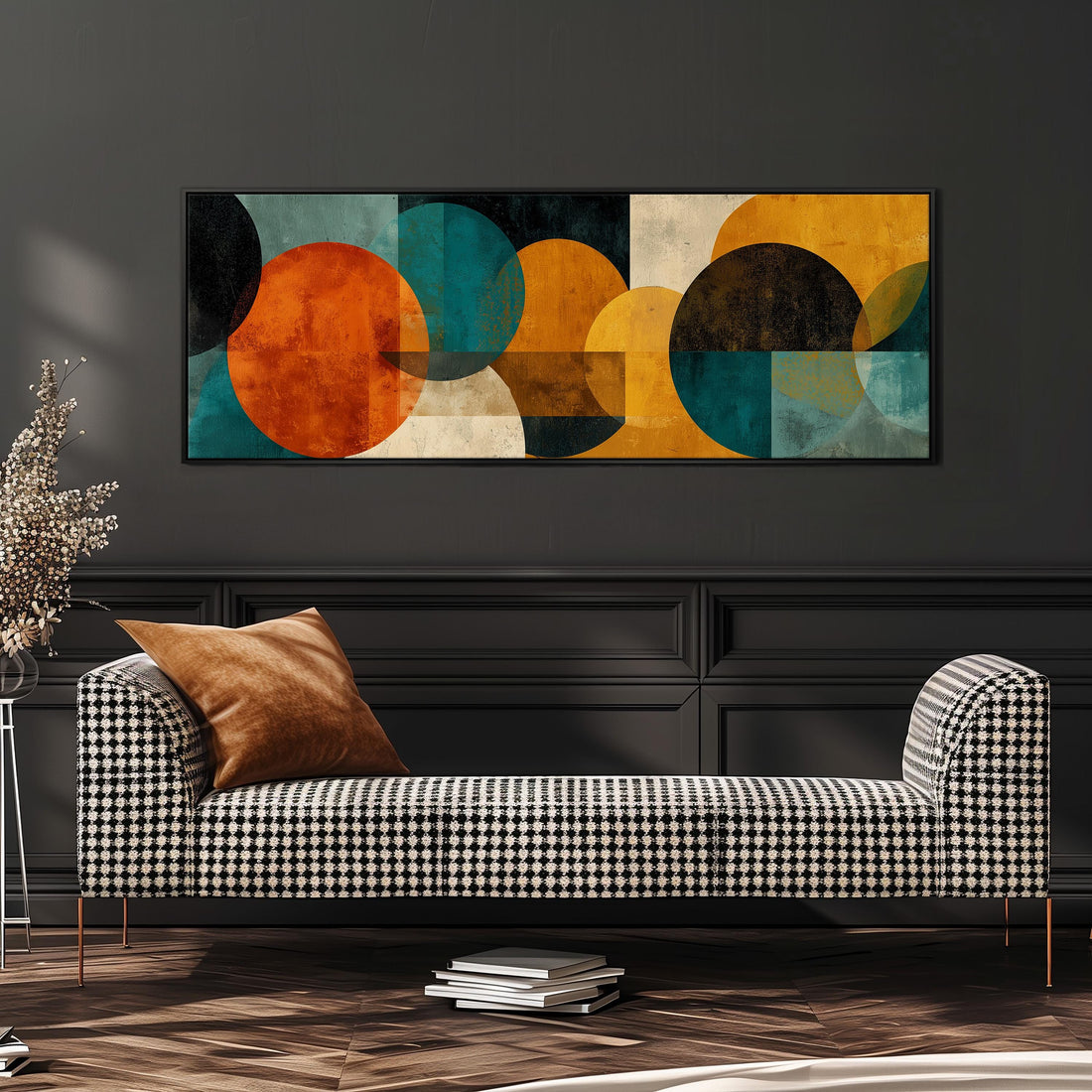 a modern living room with a black and white checkered sofa, a stack of books, and a large abstract painting on the wall.