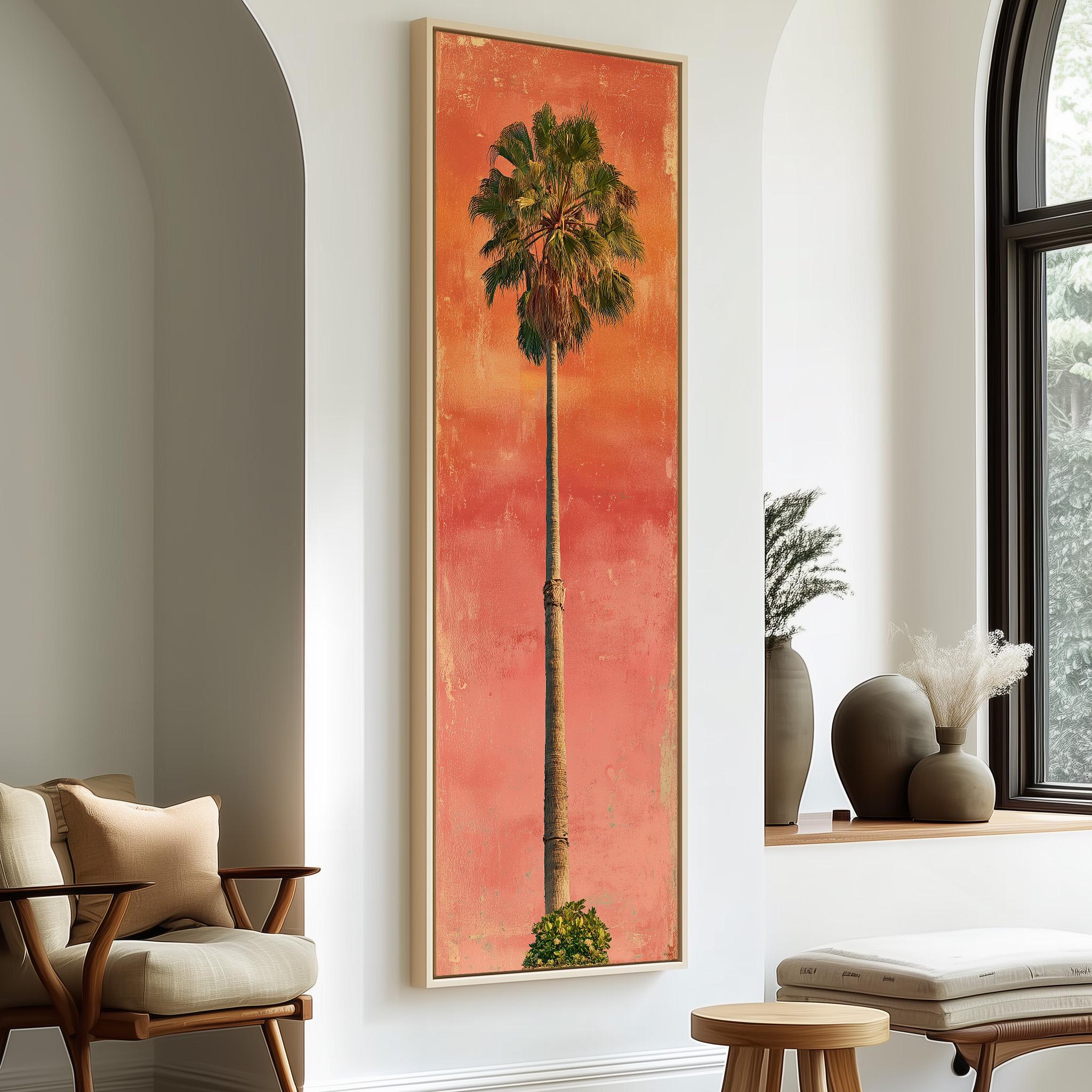 a large framed painting of a palm tree on a wall, with a wooden chair and a small table in the foreground.