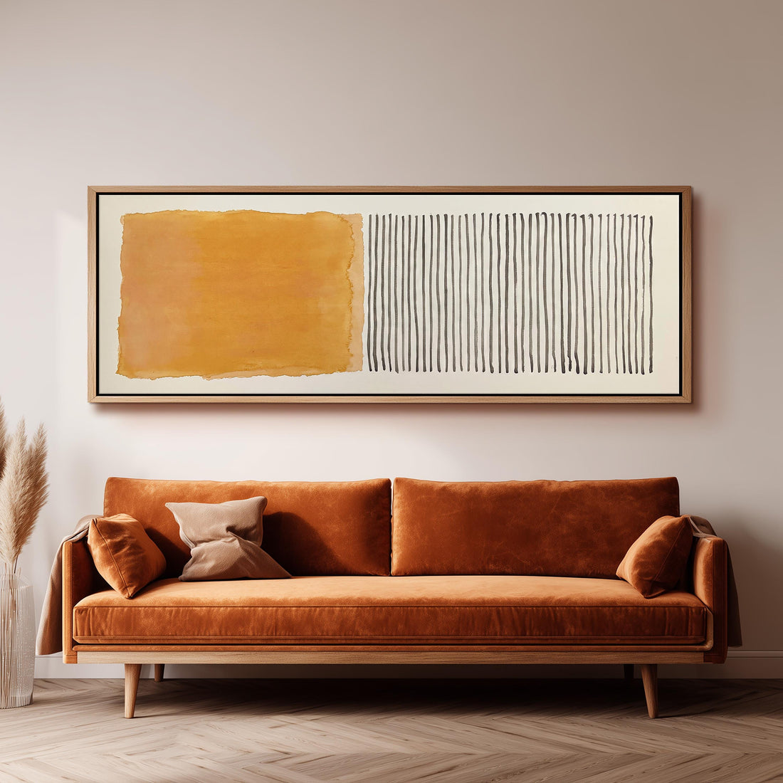 Gold wash beside charcoal line stripes long horizontal canvas print above a sofa in a living room