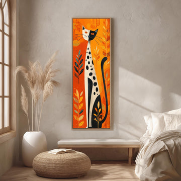 a large, colorful painting of a cat with a predominantly orange and black color scheme, hanging on a wall in a room with a wooden floor and a white bed.