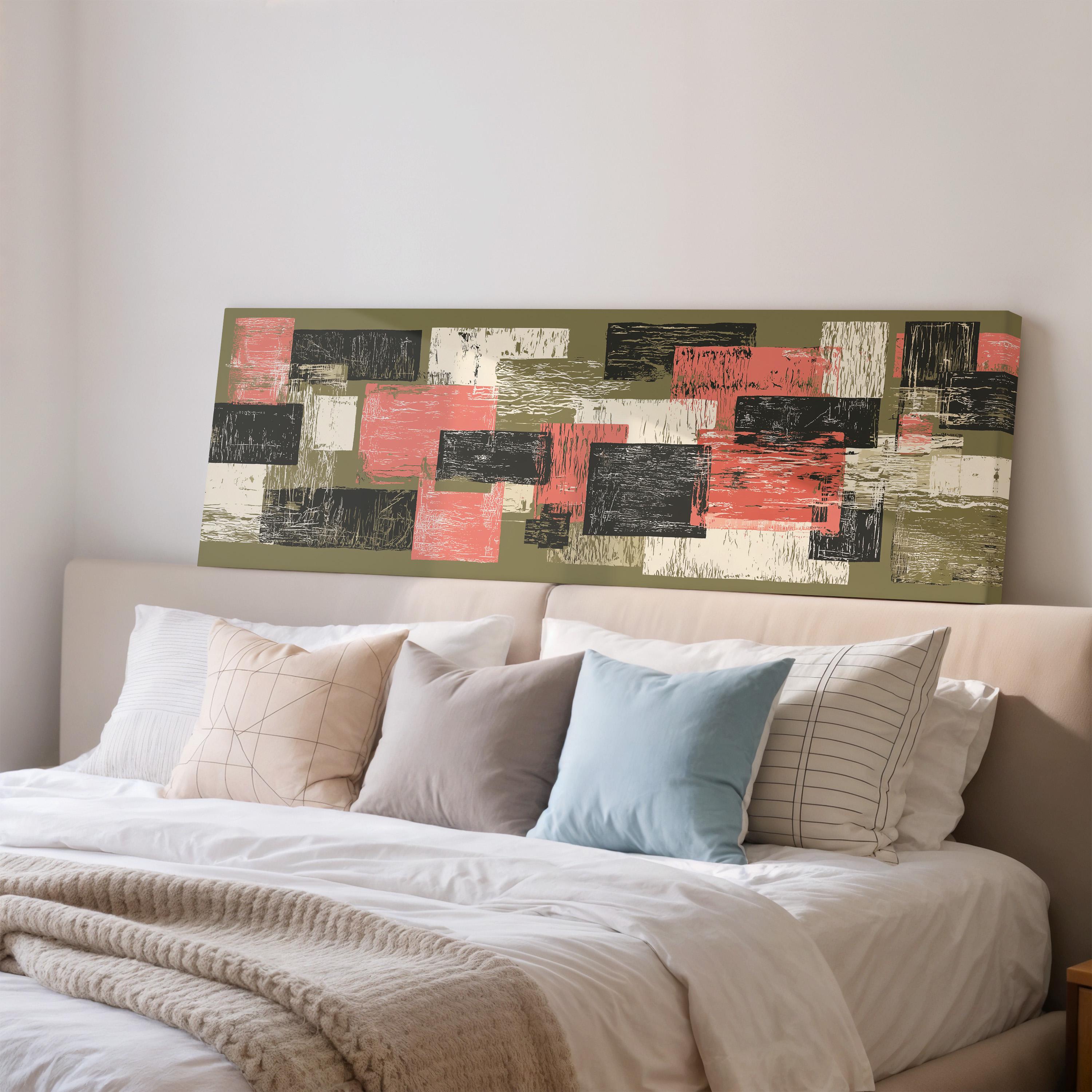 a cozy bedroom with a large bed adorned with a variety of pillows and a blanket. Above the bed, there is a large abstract painting featuring a mix of green, red, and black colors.