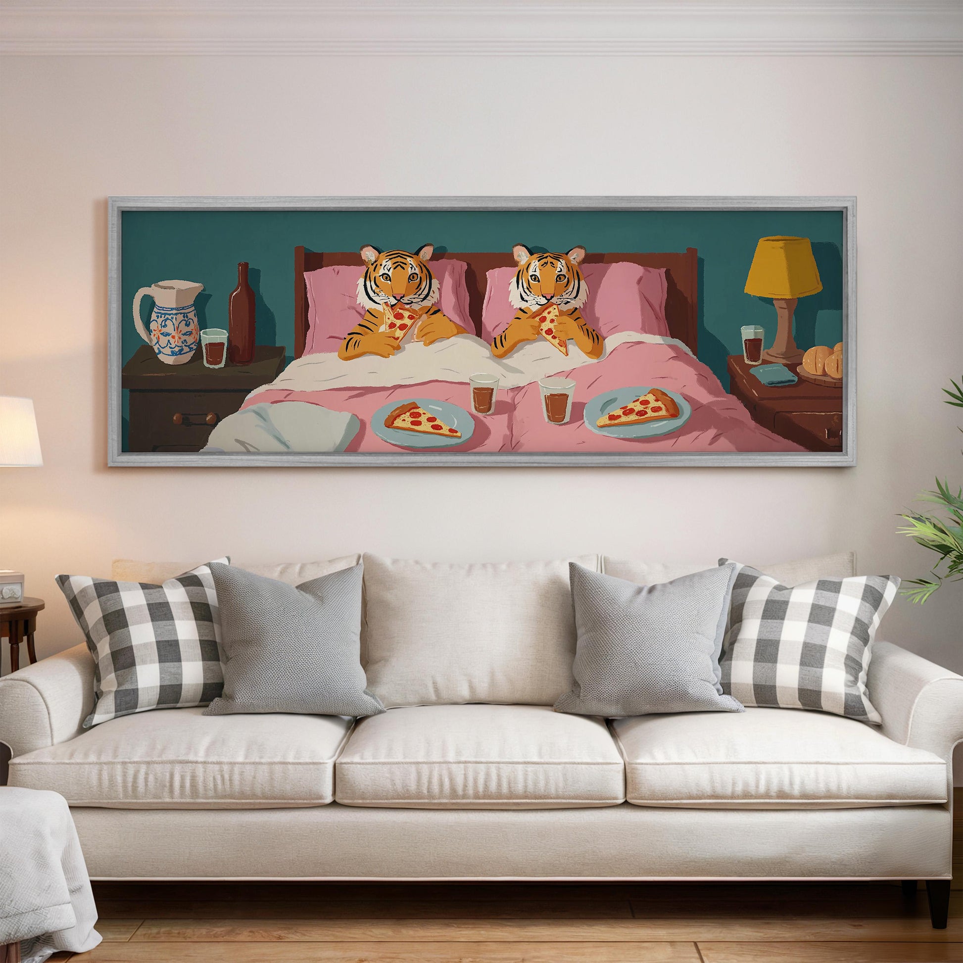 a large painting of two tiger cubs lying in bed and eating pizza, with a cozy bedroom scene in the background.