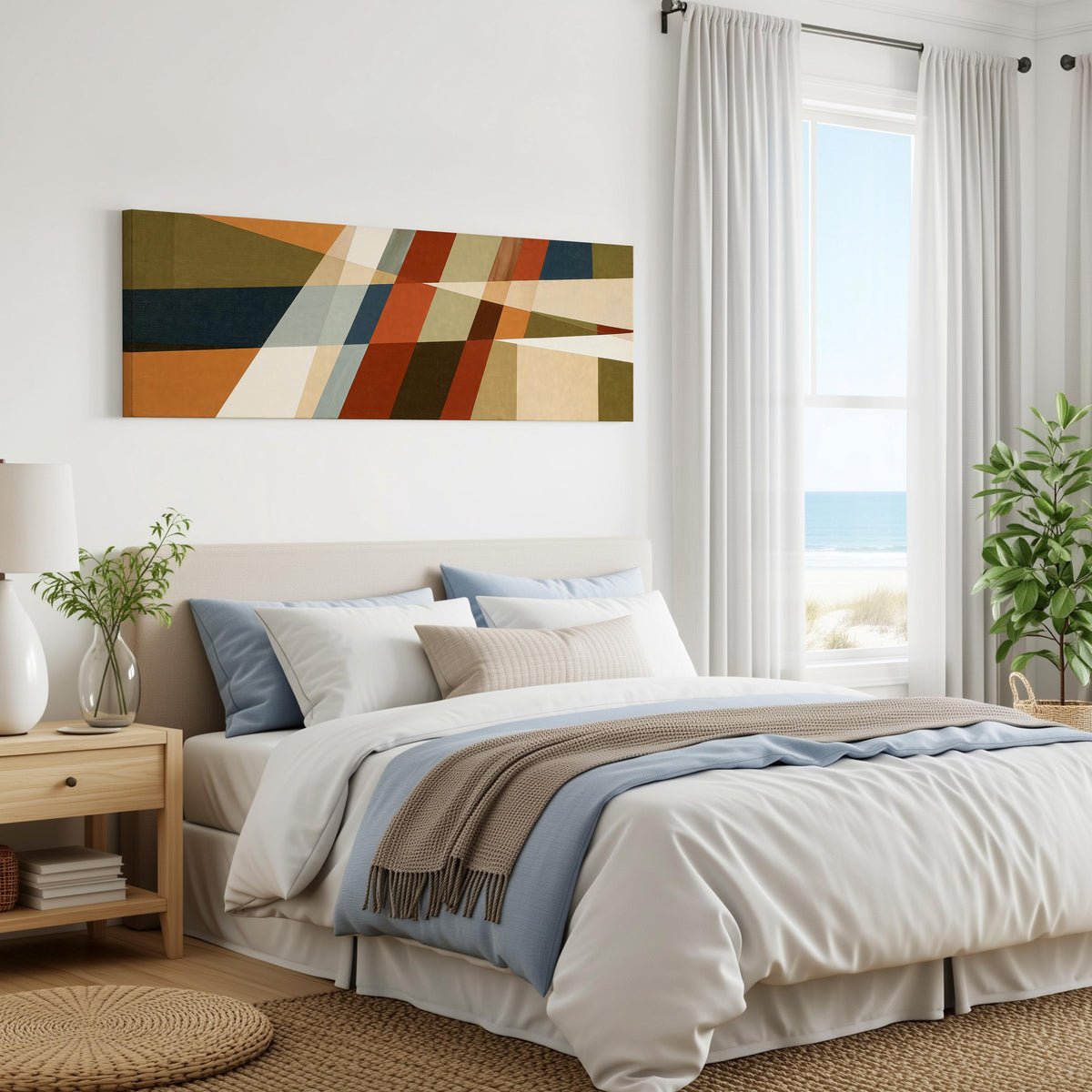 Rust and navy diagonal color blocks panoramic canvas print above a bed in a coastal bedroom