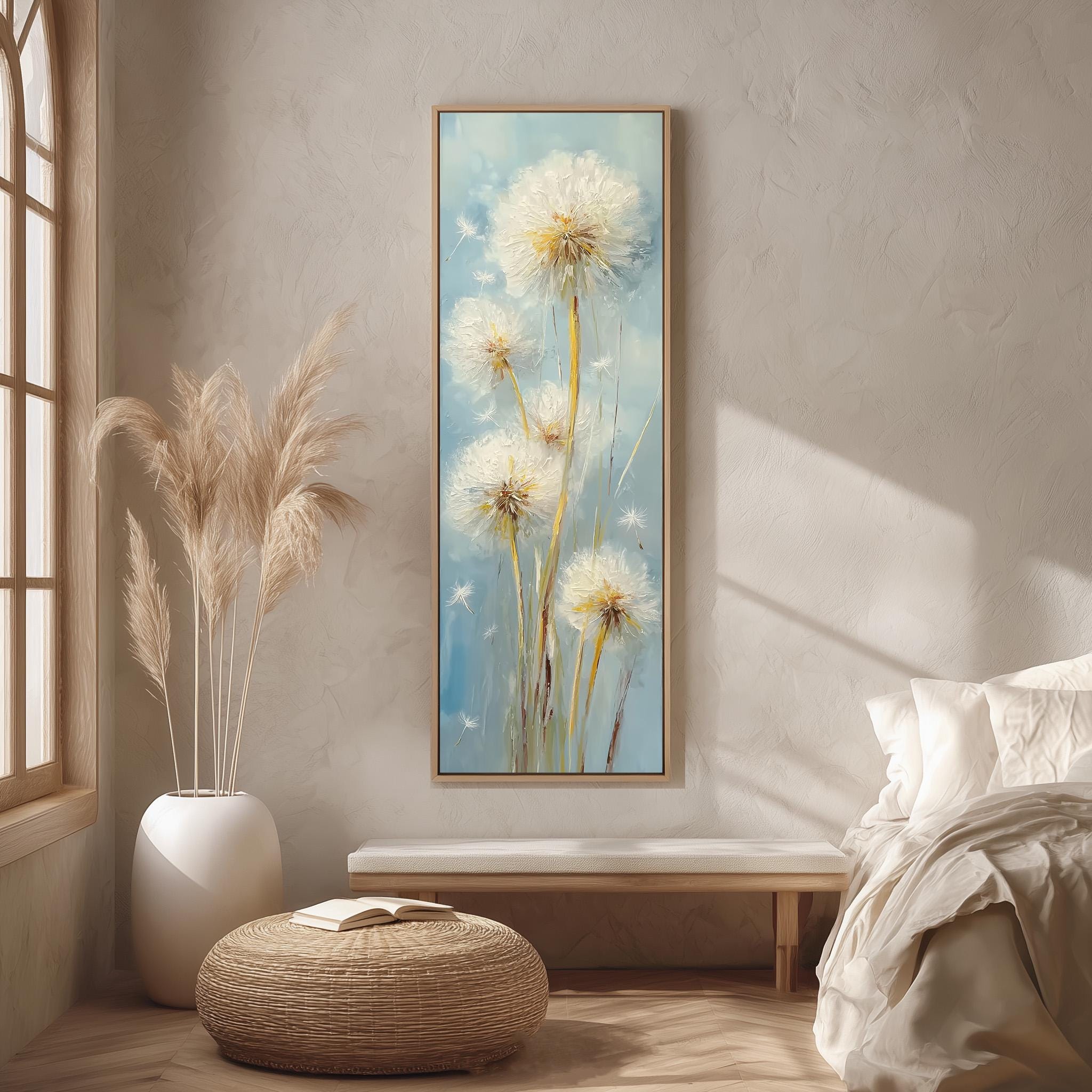 a serene and cozy bedroom scene, featuring a large painting of dandelions hanging on the wall, a white bed with a white pillow, a white vase with tall potted plants, and a woven ottoman.