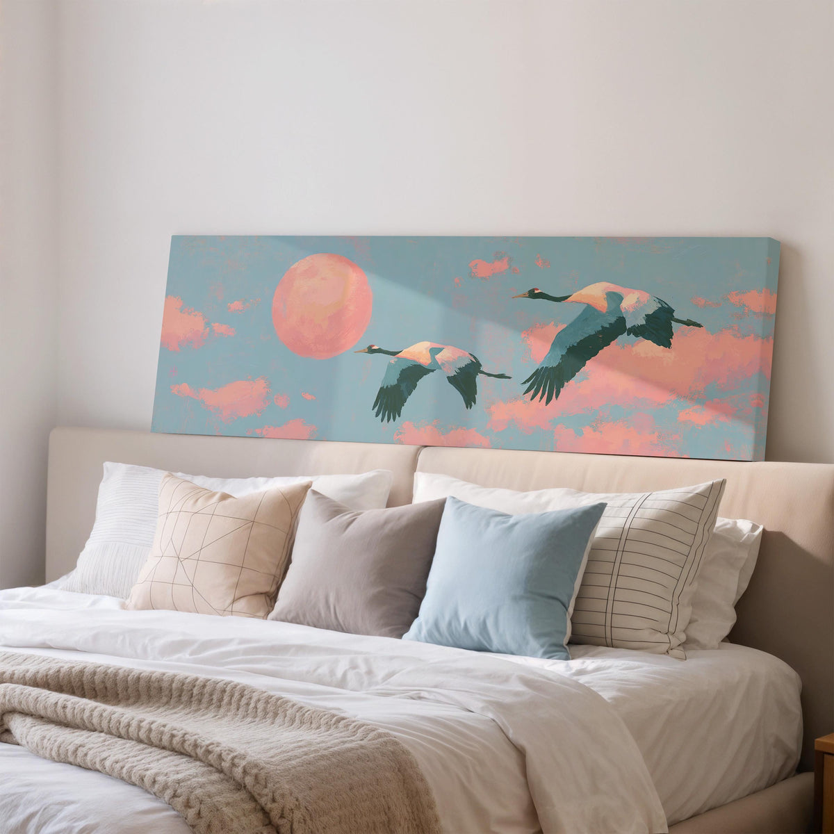 Two cranes flying at sunset wide panoramic canvas print above a bed in a bedroom