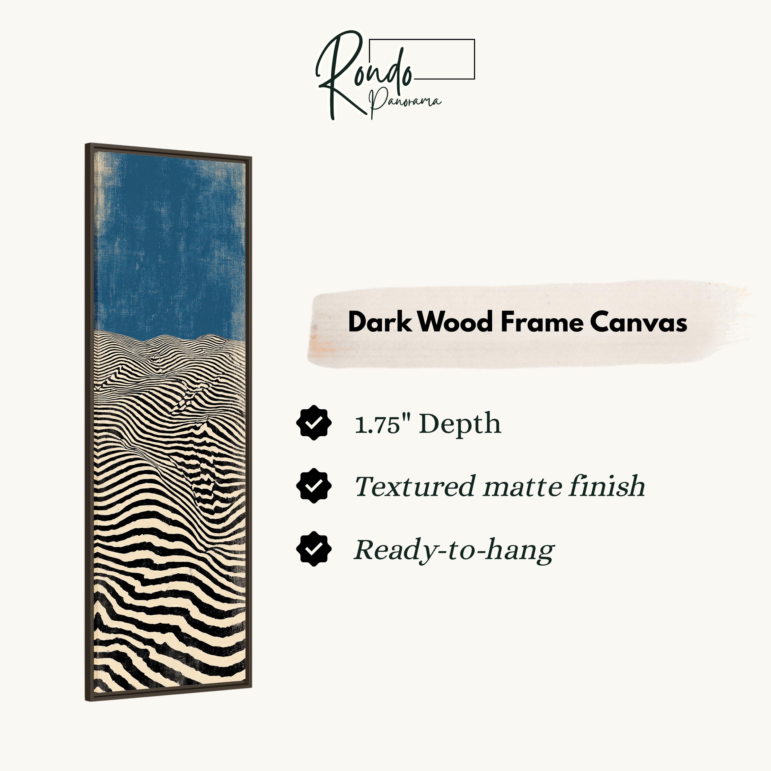 The image is a product description for a dark wood frame canvas. It features a striking abstract artwork with a blue background and black and white stripes. The canvas has a 1.75" depth, a textured matte finish, and is ready to hang.