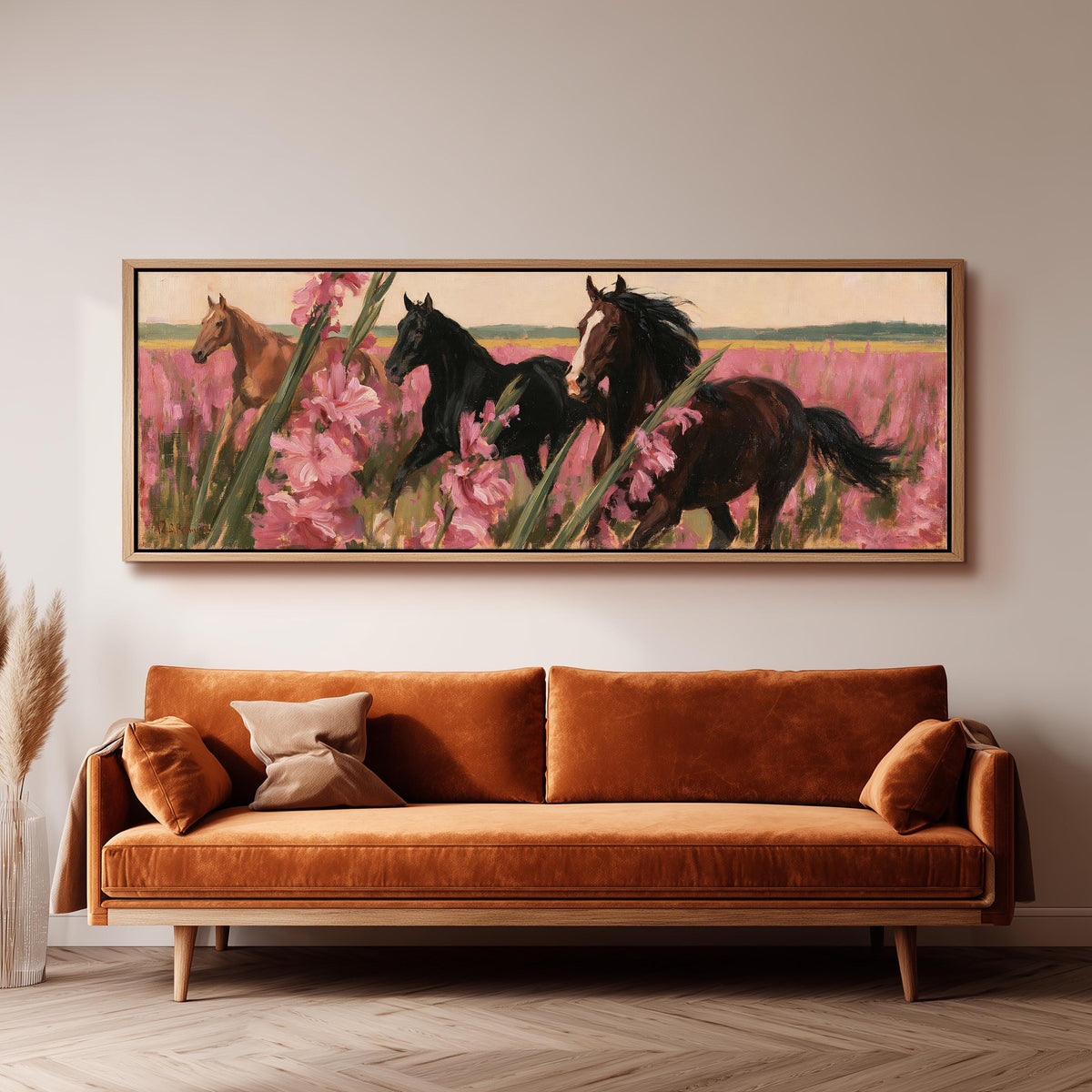 Horses running through pink gladiolus long horizontal canvas print above a sofa in a living room