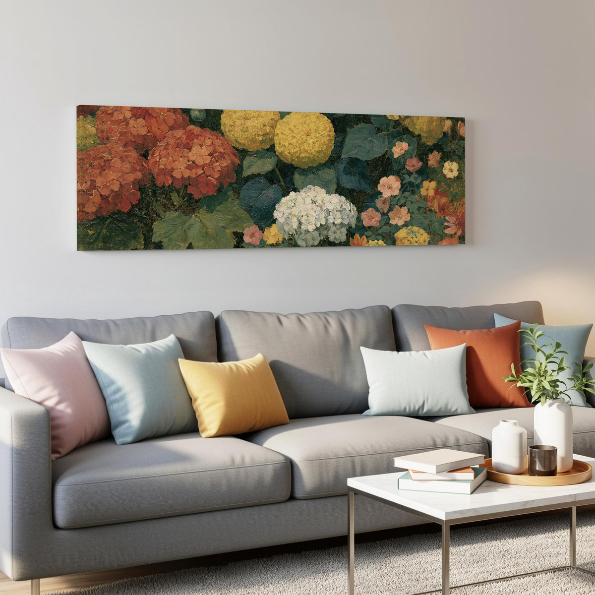 Warm hydrangea and dahlia bouquet panoramic canvas print above a grey sofa in a living room