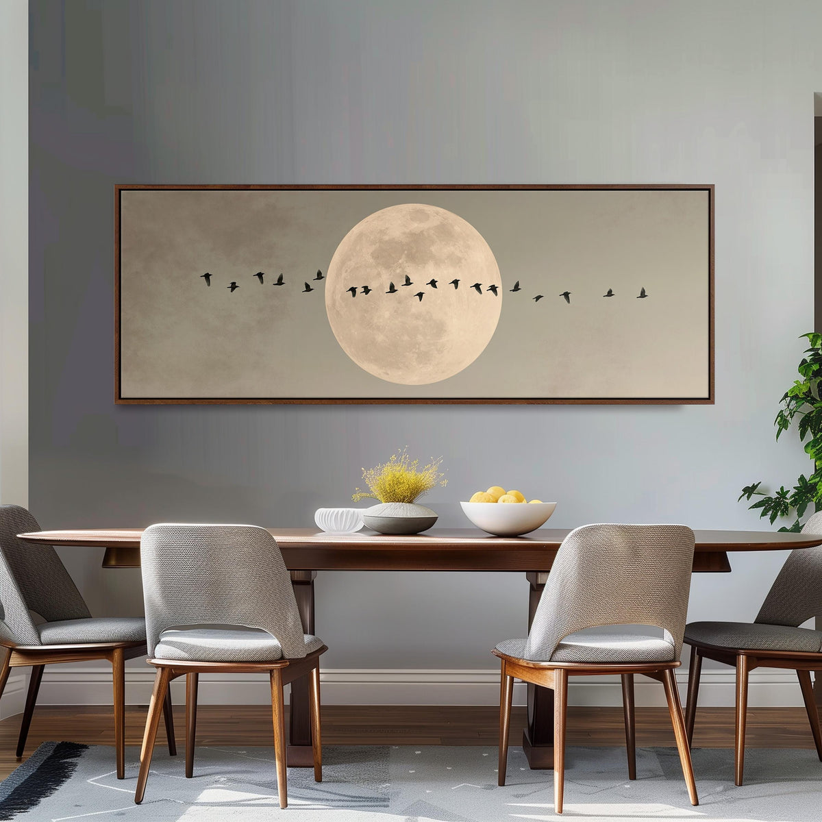 Geese crossing a full moon on grey long horizontal canvas print above a dining table