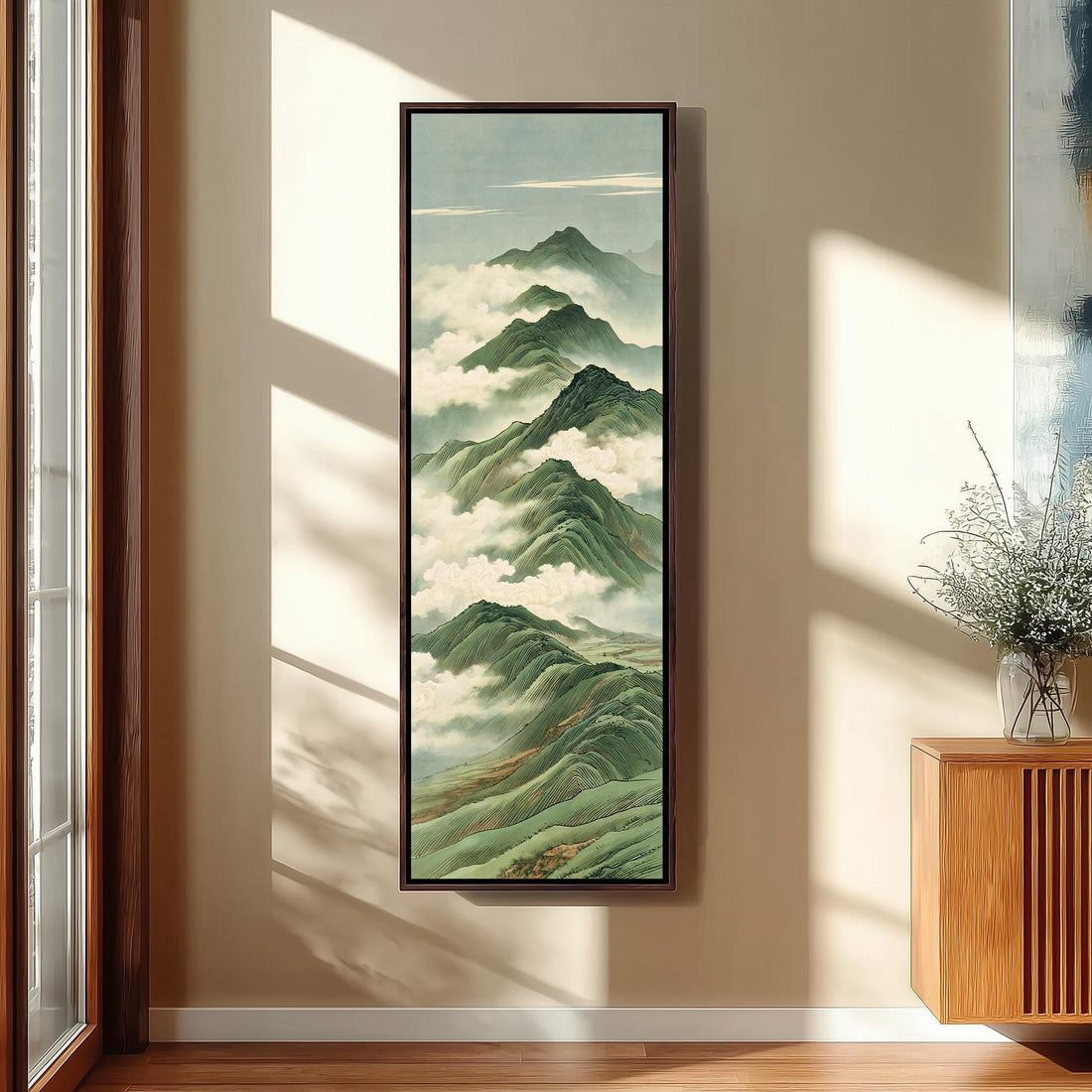 Green mountain peaks rising through clouds long vertical canvas print in a sunlit living space