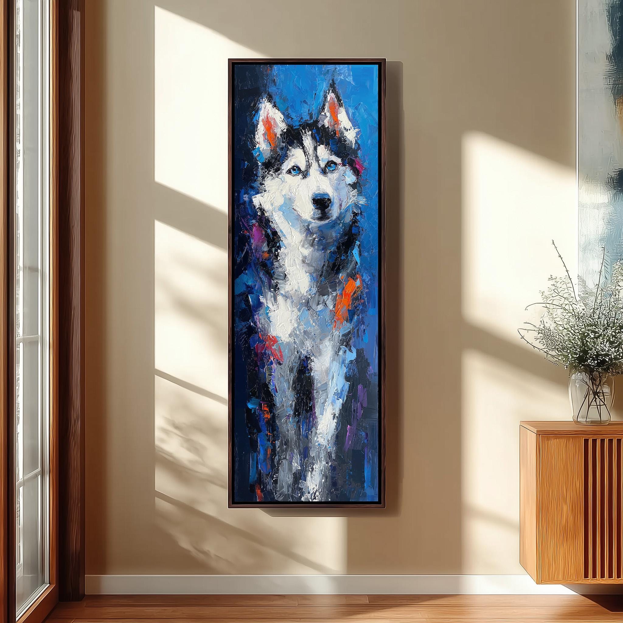 a large, colorful painting of a husky dog hanging on a wall in a room with a wooden floor and a window.