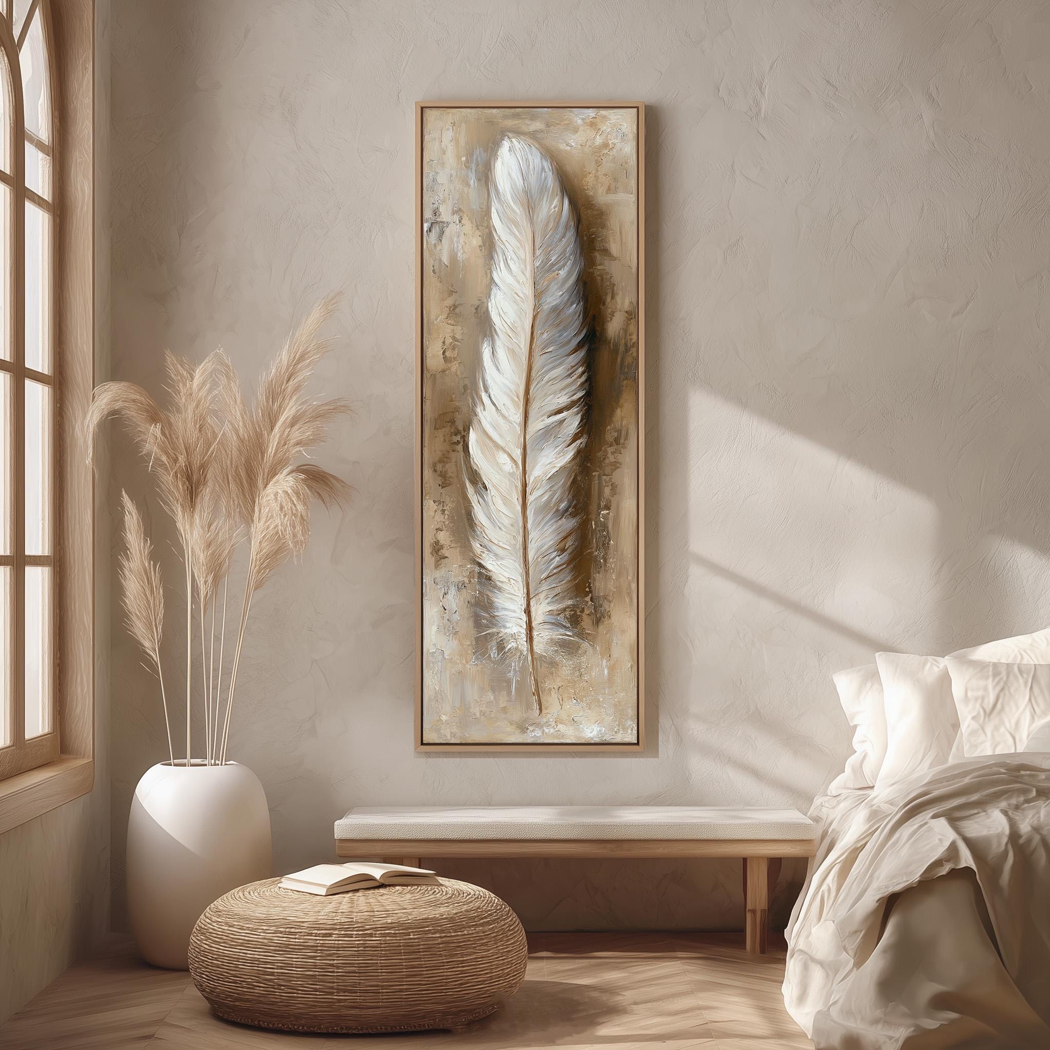 a serene and minimalist bedroom interior, featuring a large framed artwork of a feather on the wall, a white bed with a white pillow, a white vase with tall potted plants, and a woven ottoman.