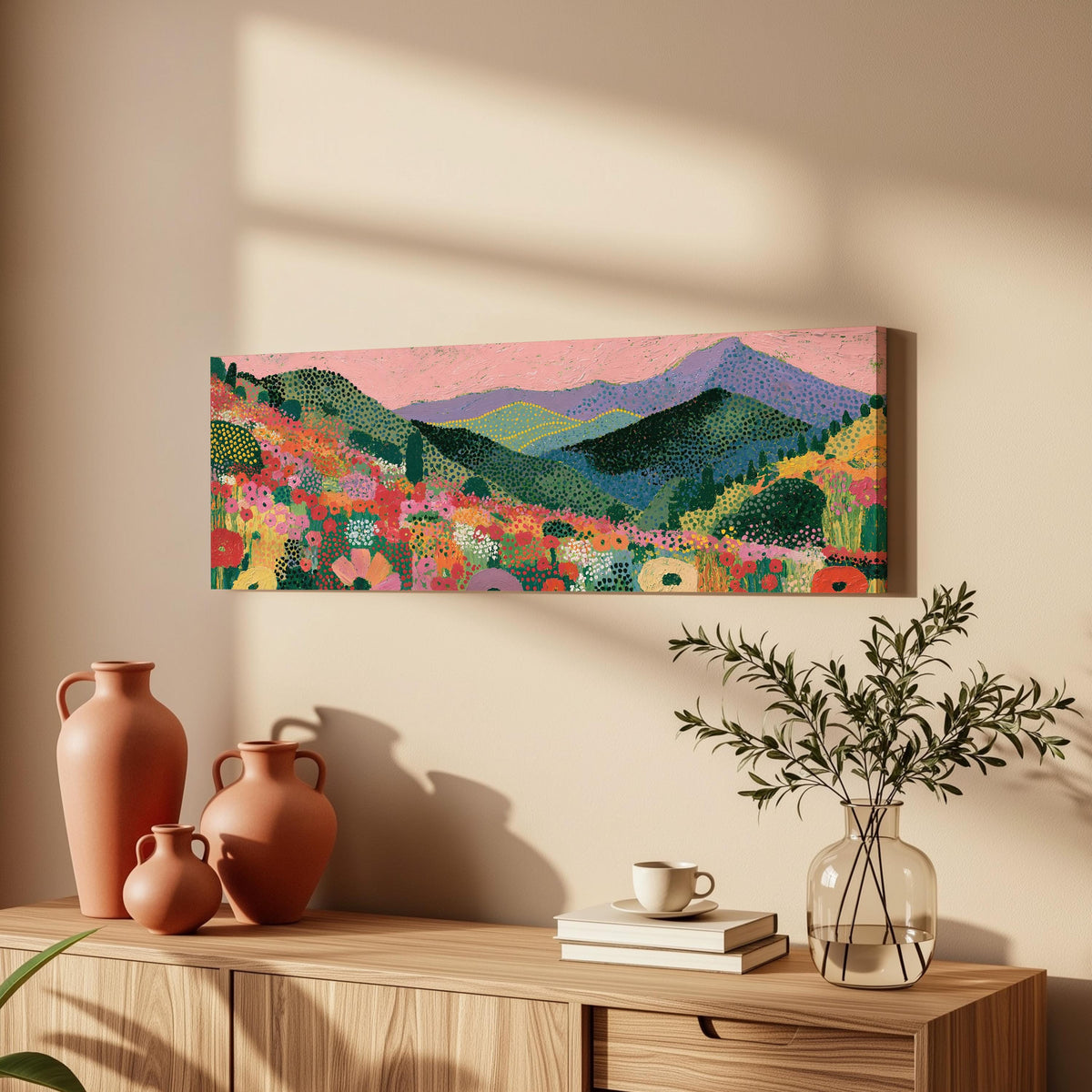 Purple mountains over a flower meadow long horizontal canvas print above a wooden sideboard
