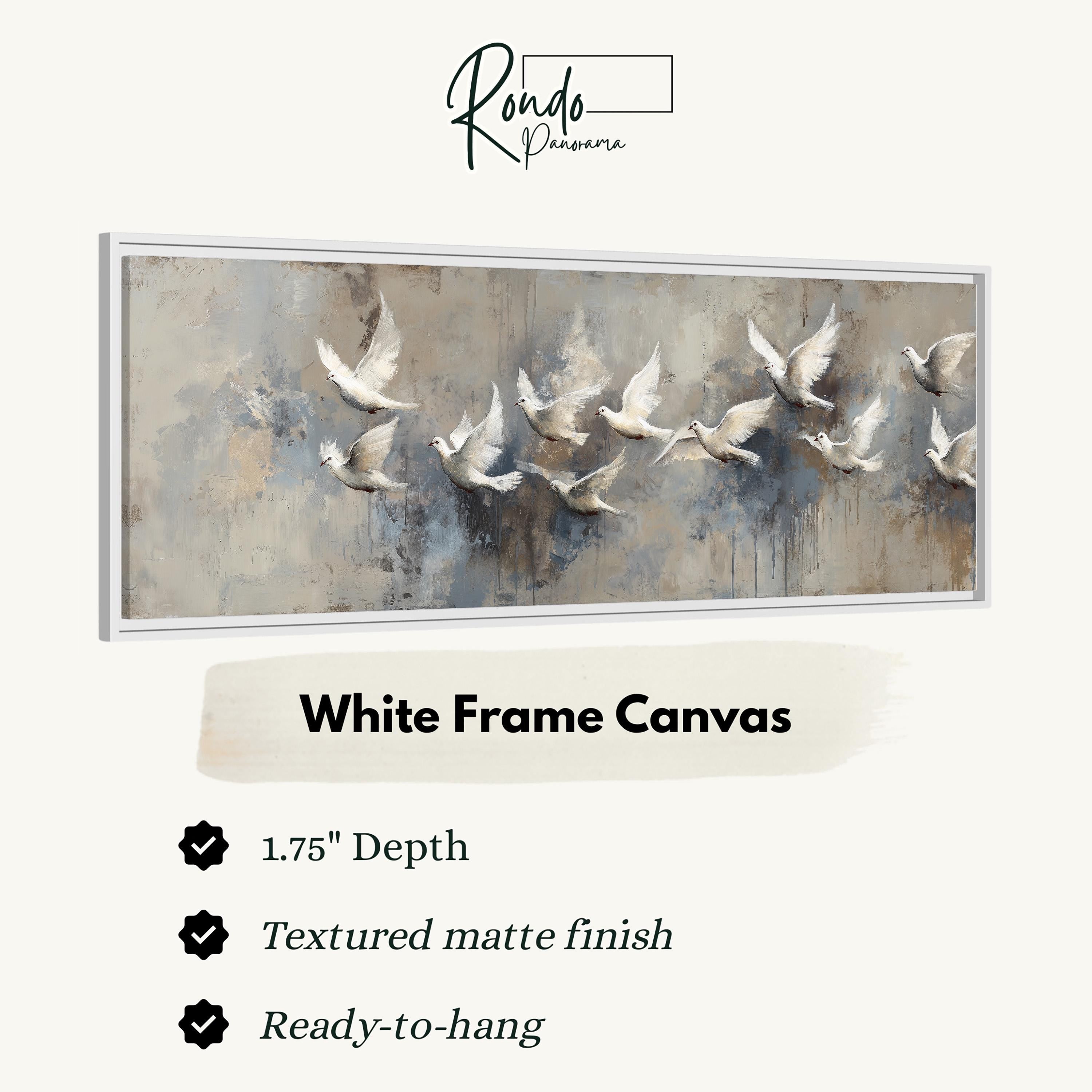 a white frame canvas with a painting of a flock of white birds in flight.