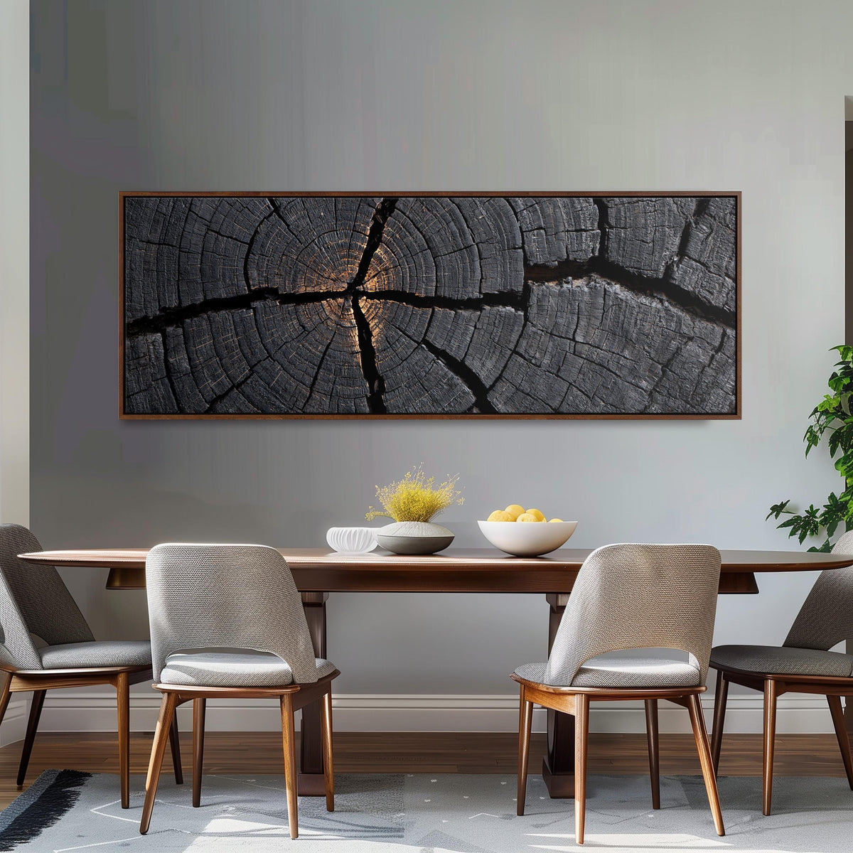 Charcoal tree ring cross section long horizontal canvas print above a dining table
