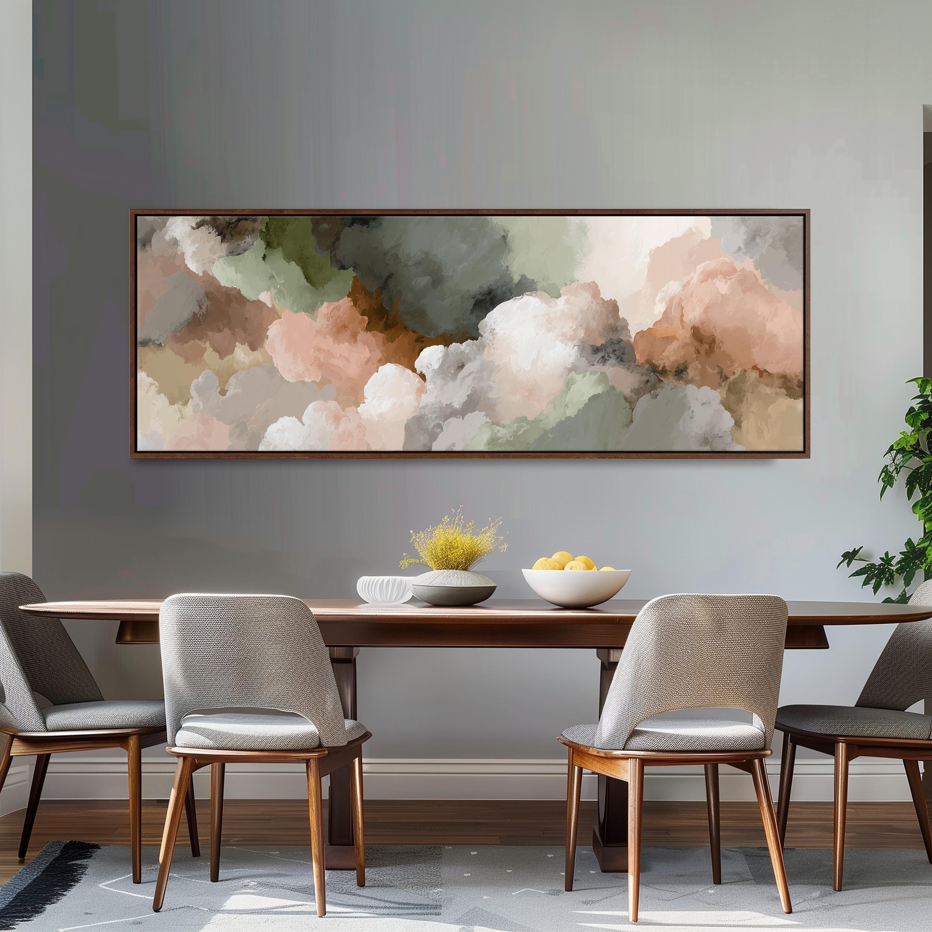 a dining room with a large abstract painting hanging on the wall above a wooden table with four chairs. The table is set with a bowl of fruit and a vase of flowers, creating a cozy and inviting atmosphere.