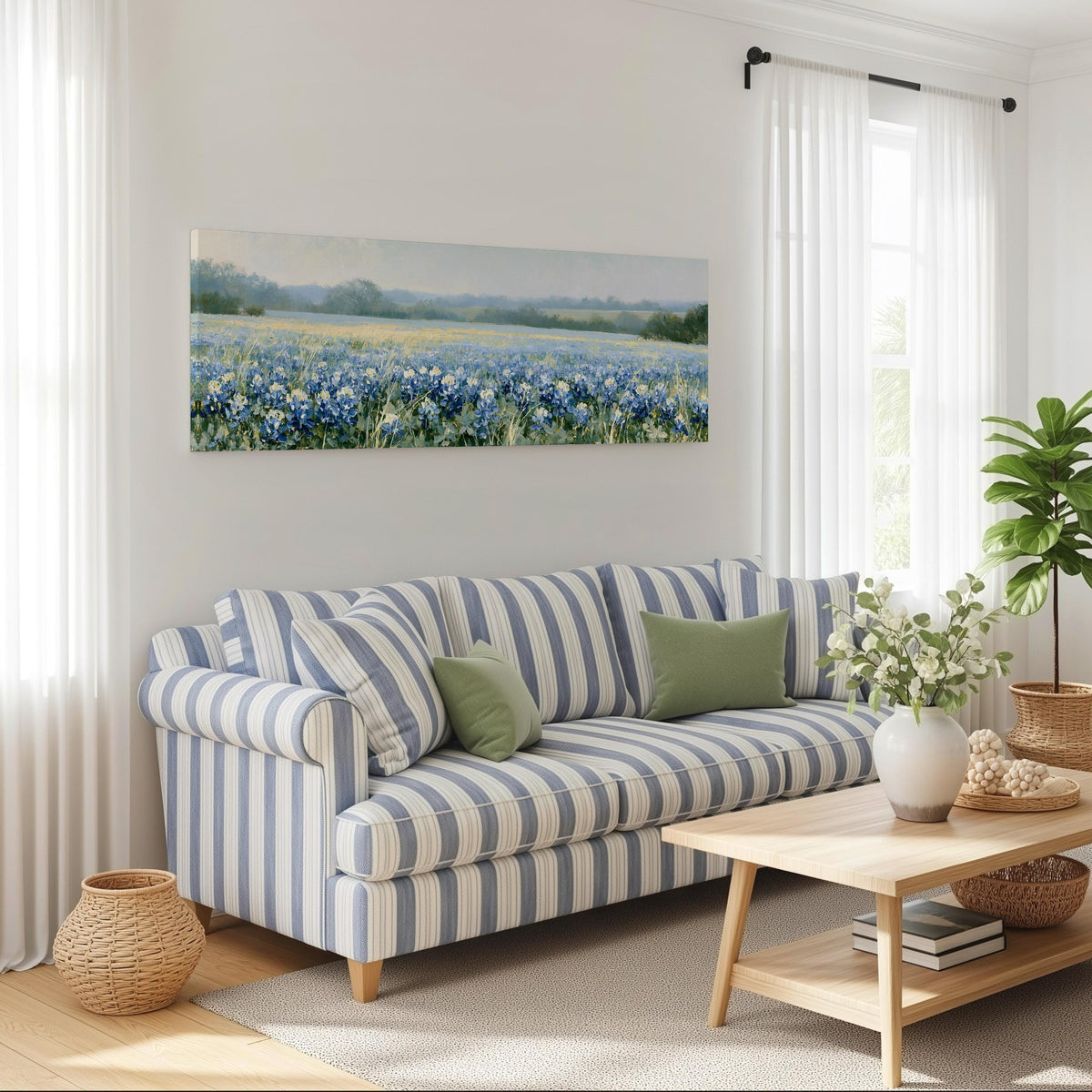 Field of bluebonnets long horizontal canvas print above a striped sofa in a coastal living room