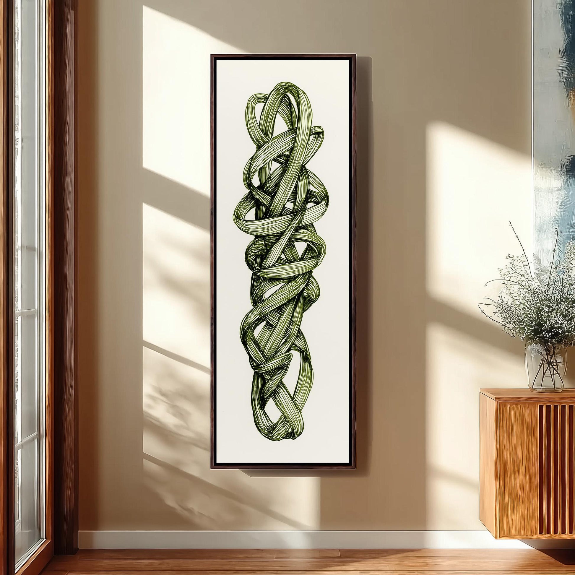 a large framed artwork of a green plant with twisted, intertwined leaves hanging on a wall in a room with wooden paneling.