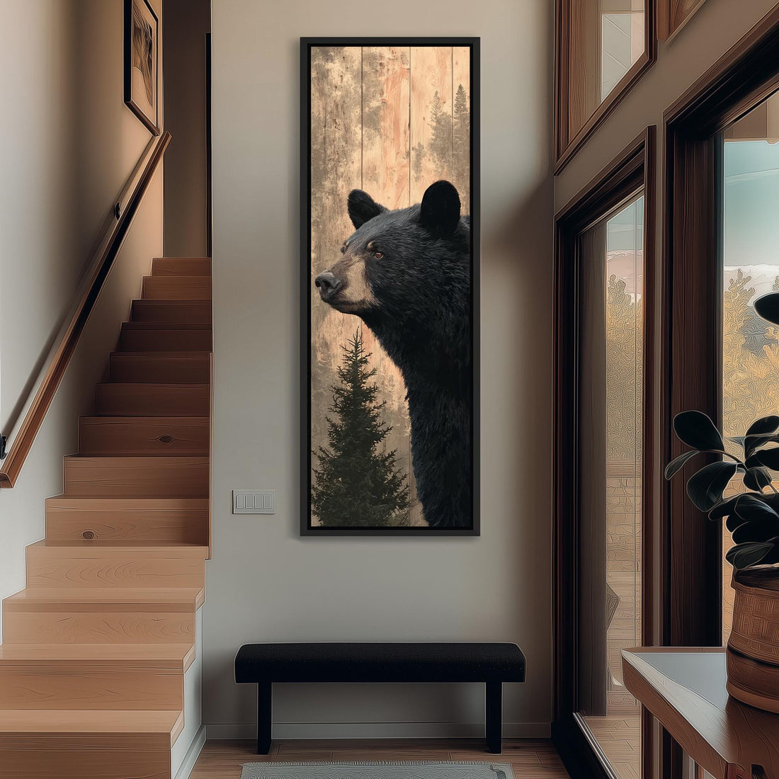 a large black bear in a wooden frame, hanging on a wall in a hallway.