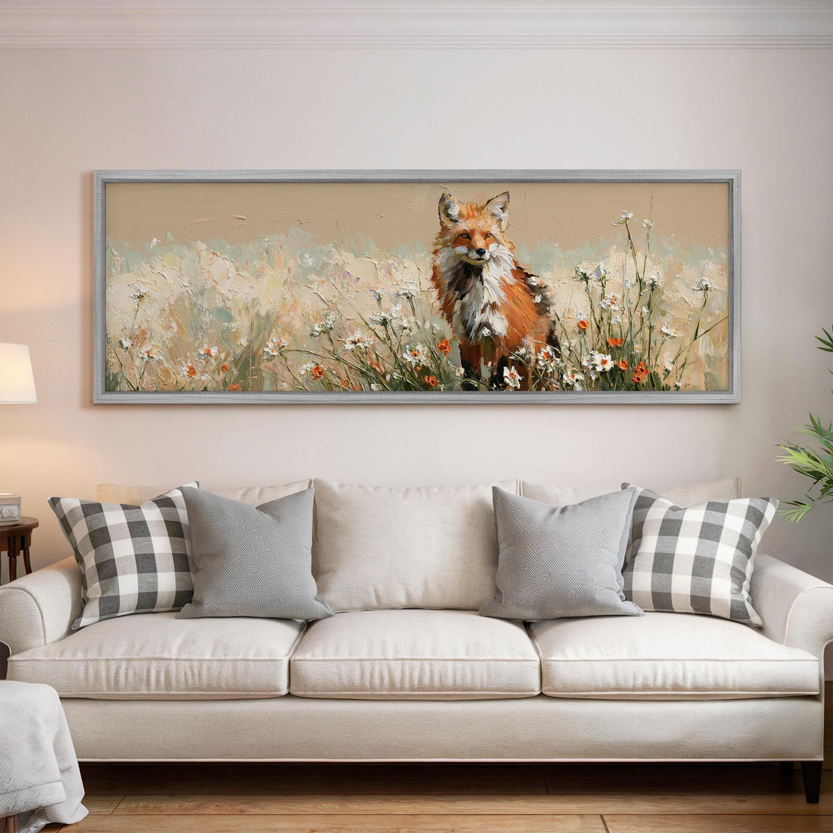 Red fox sitting among white wildflowers panoramic canvas print above a white sofa in a bright living room