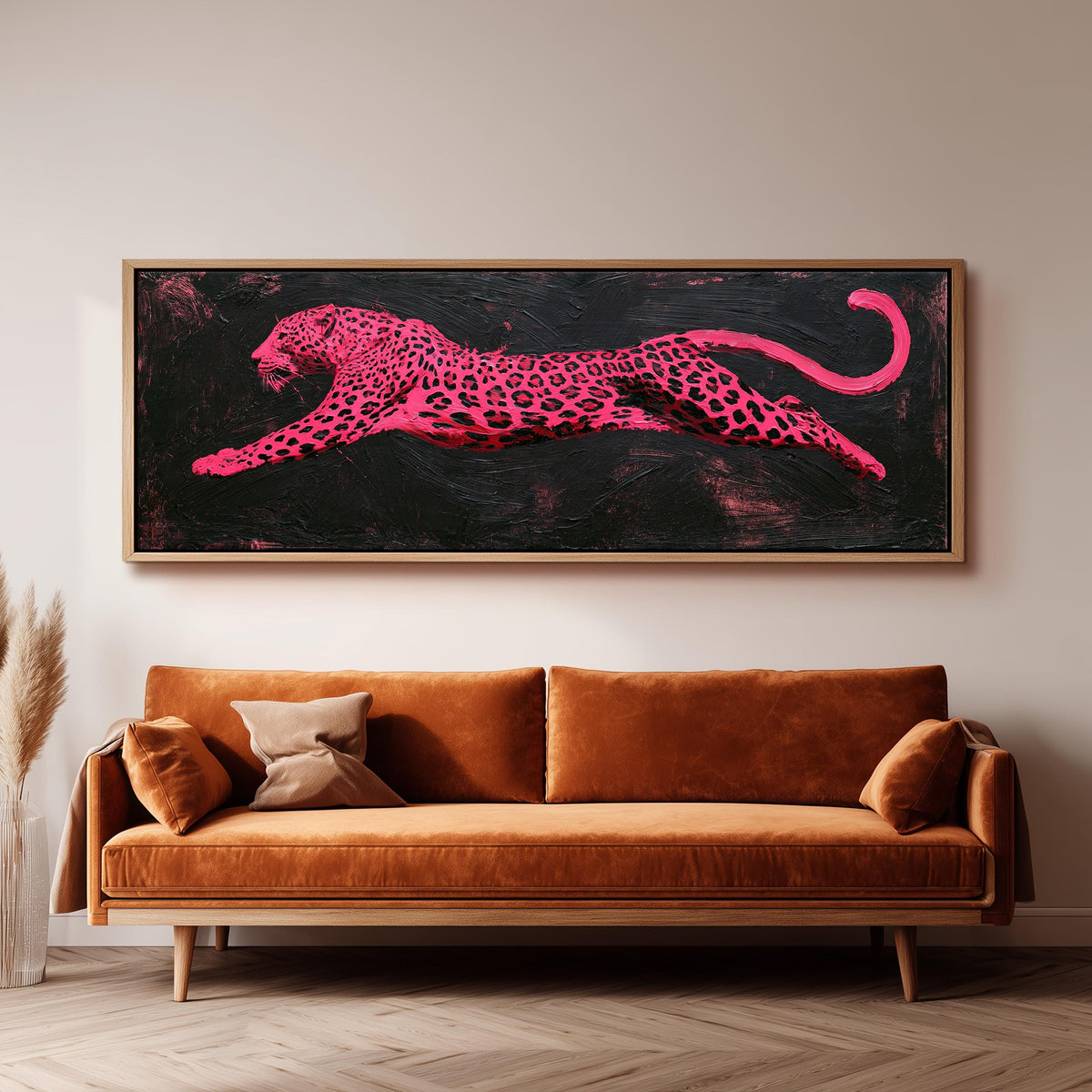 Pink leaping leopard wide panoramic canvas print above a bench in a dark living room