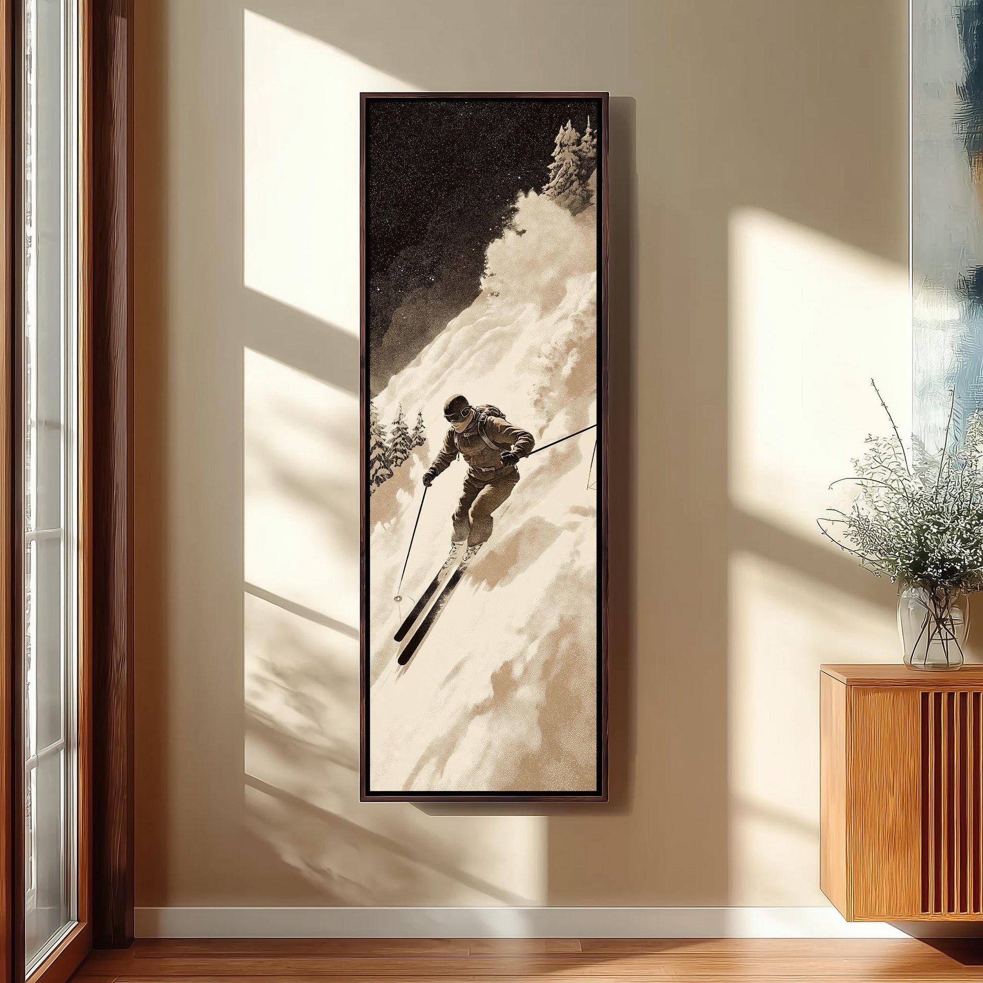 A framed black and white photograph of a skier in action, captured in a snowy mountain setting.