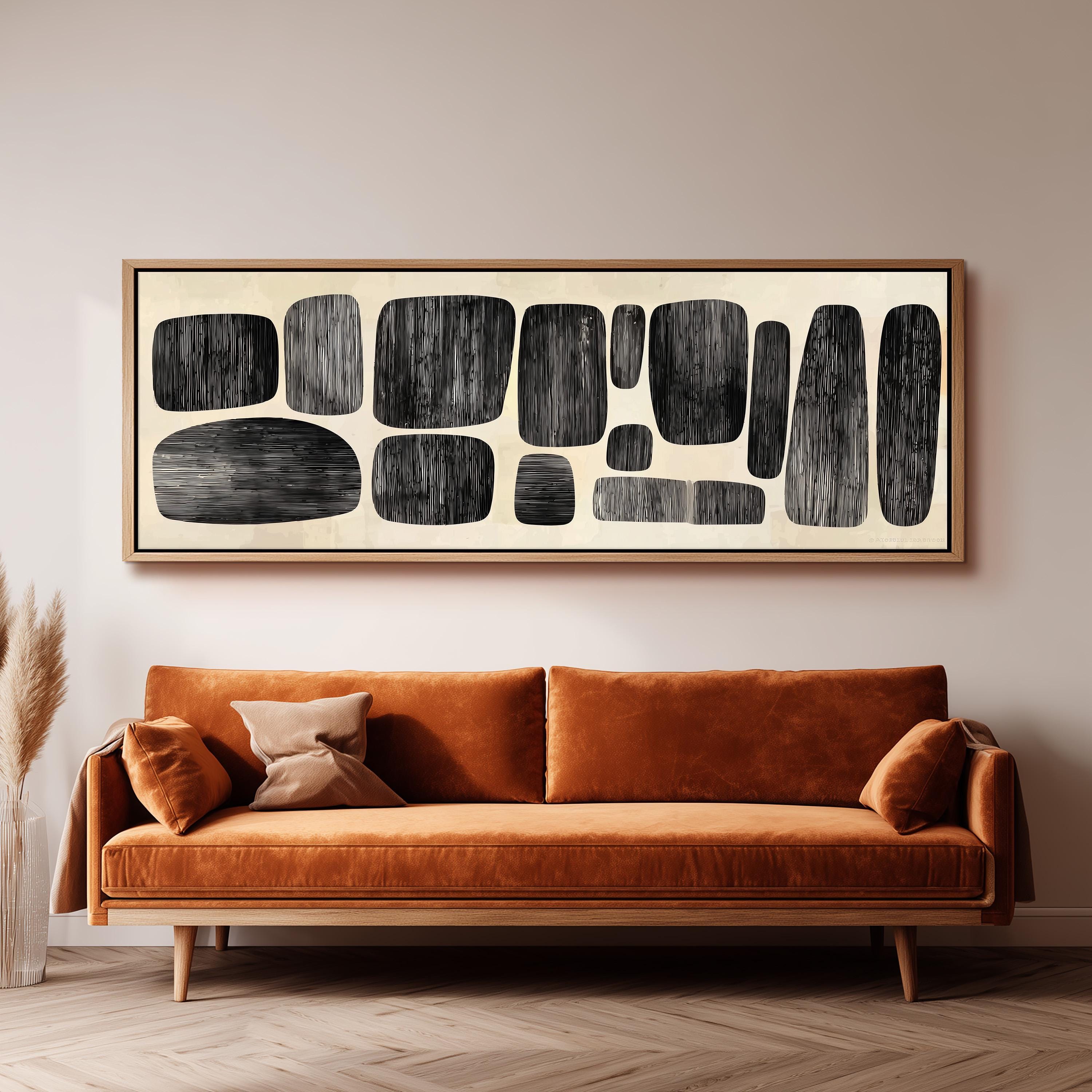 a large abstract painting hanging on a wall above a brown sofa with orange cushions.