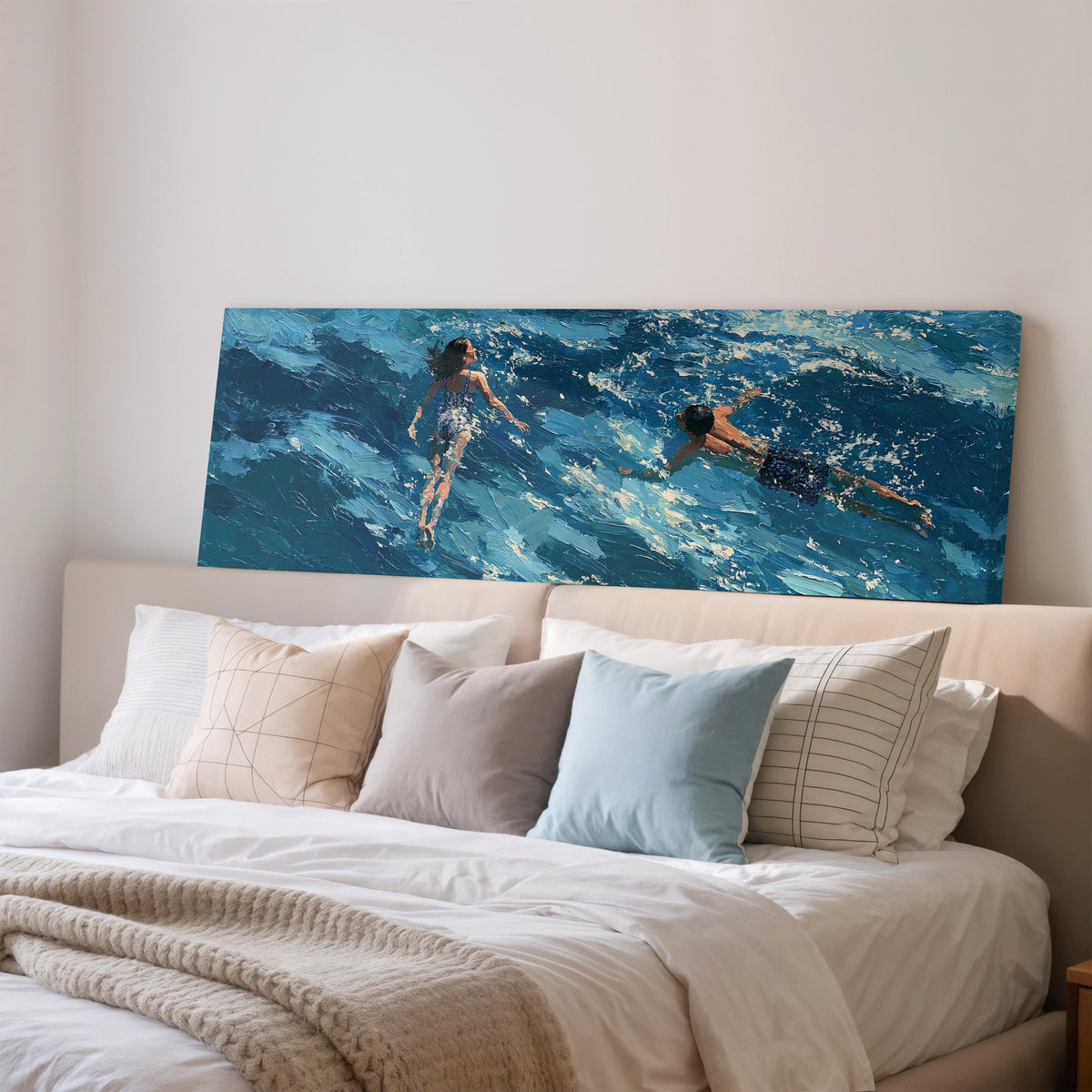 Two swimmers in turquoise waves wide panoramic canvas print above a bed in a bedroom