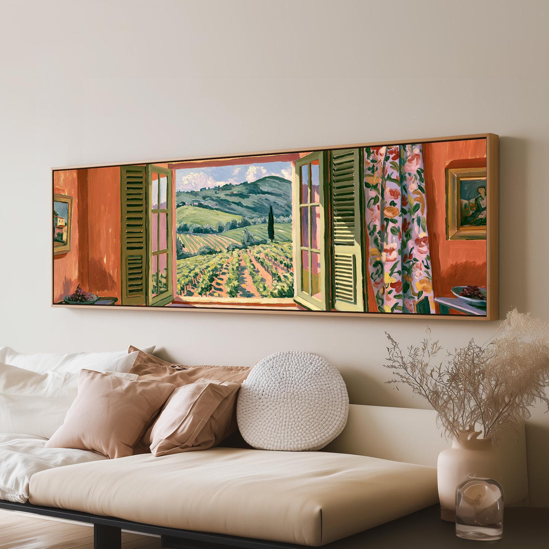 Tuscan vineyard hills through an orange room window long horizontal canvas print above a sofa in a living room