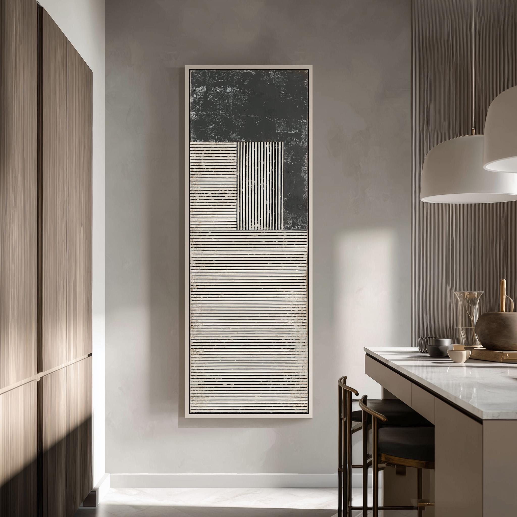 a modern kitchen with a minimalist design. The focal point is a large abstract painting hanging on the wall, which adds an artistic touch to the space. The kitchen is equipped with a white countertop and a barstool, creating a clean and contemporary look.