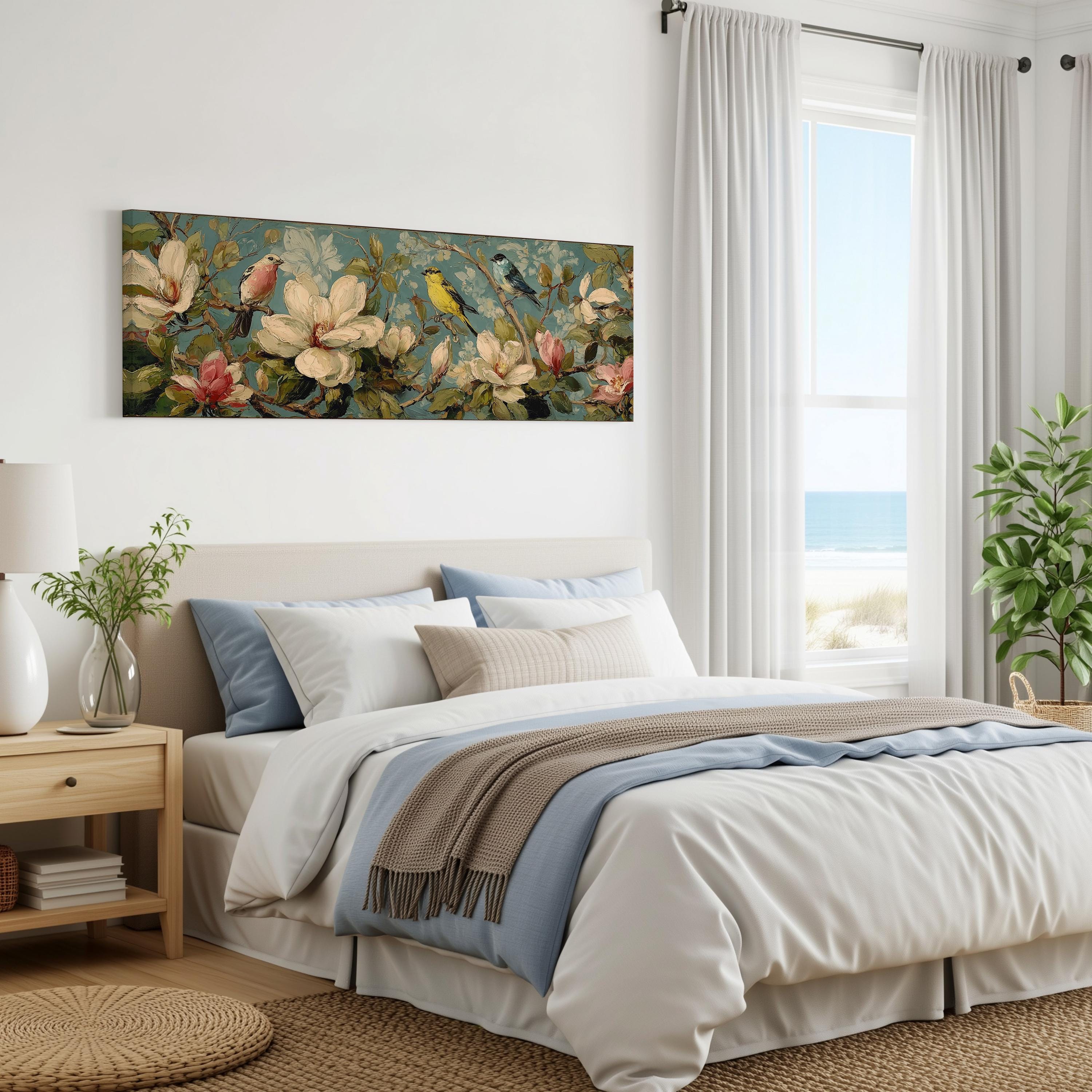 a serene bedroom with a large bed, a nightstand, and a painting of flowers on the wall. The room has a window overlooking the ocean, and the overall decor has a calming and natural aesthetic.