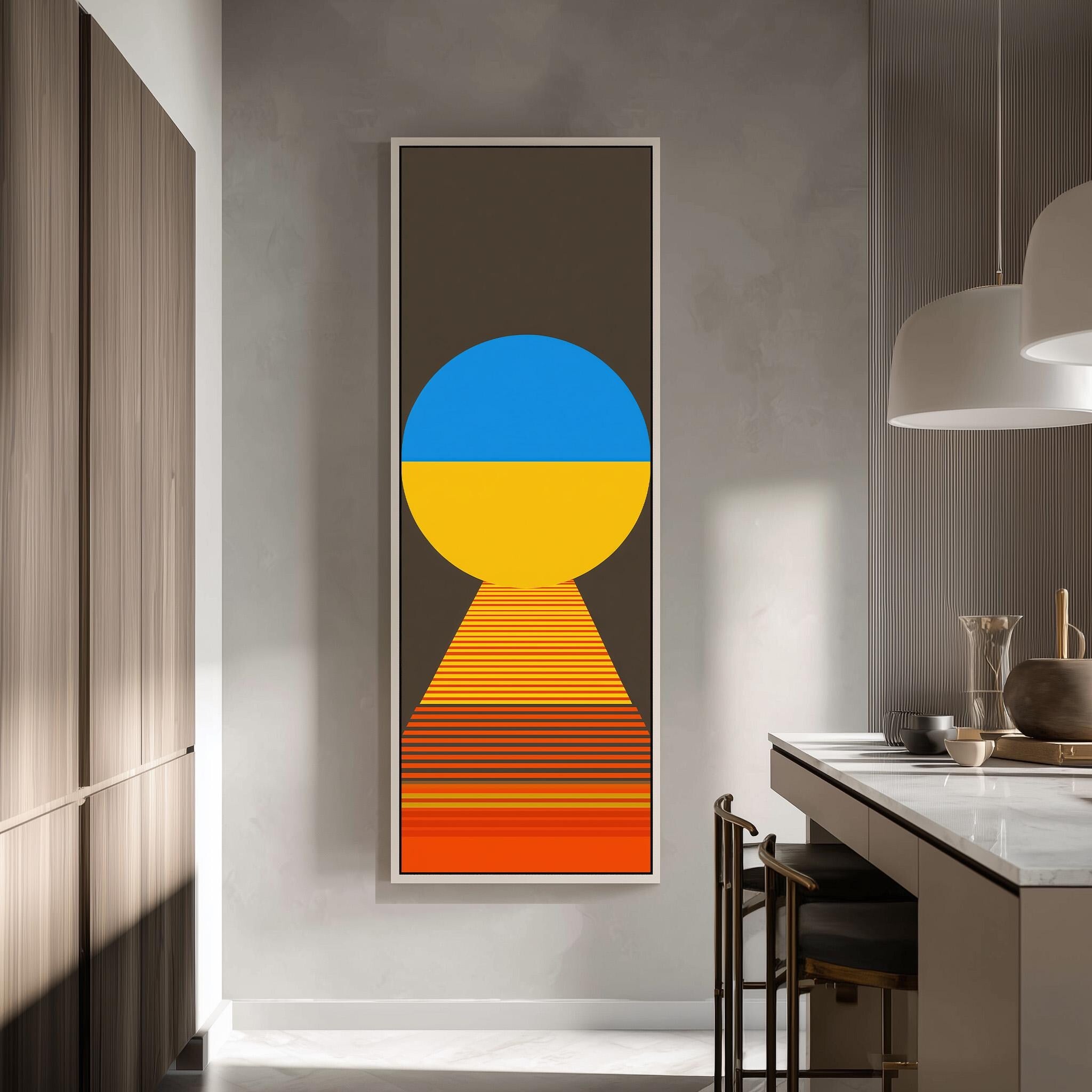 a modern kitchen with a large abstract painting hanging on the wall. The painting consists of a circle and a yellow and blue gradient, creating a striking visual contrast. The kitchen is well-lit, with a countertop and chairs visible, and a pendant light hanging above the countertop.