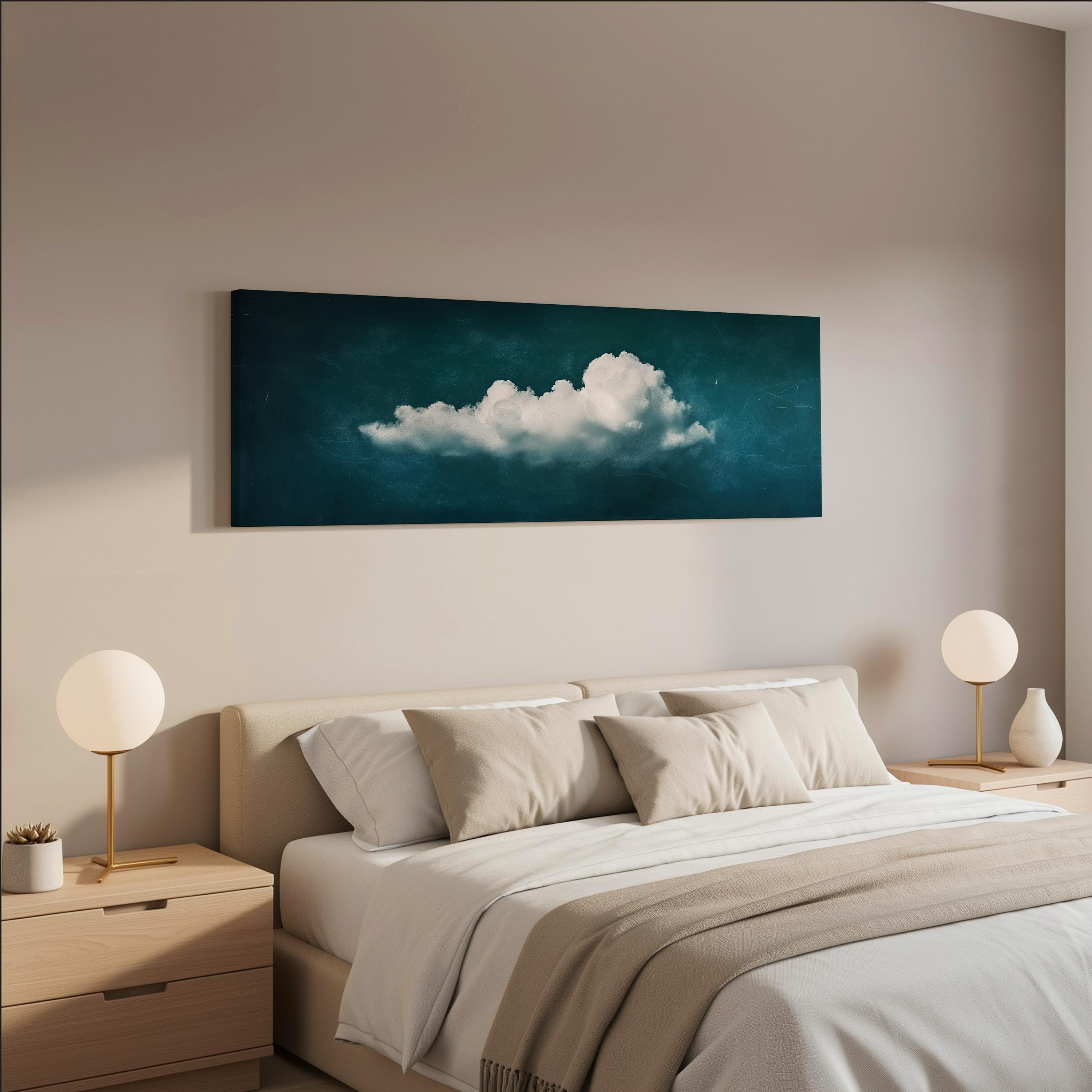 a serene bedroom scene with a large bed adorned with white linens and beige pillows, flanked by two white lamps on nightstands. Above the bed hangs a large painting of a cloud against a dark blue background, creating a calming and peaceful atmosphere in the room.