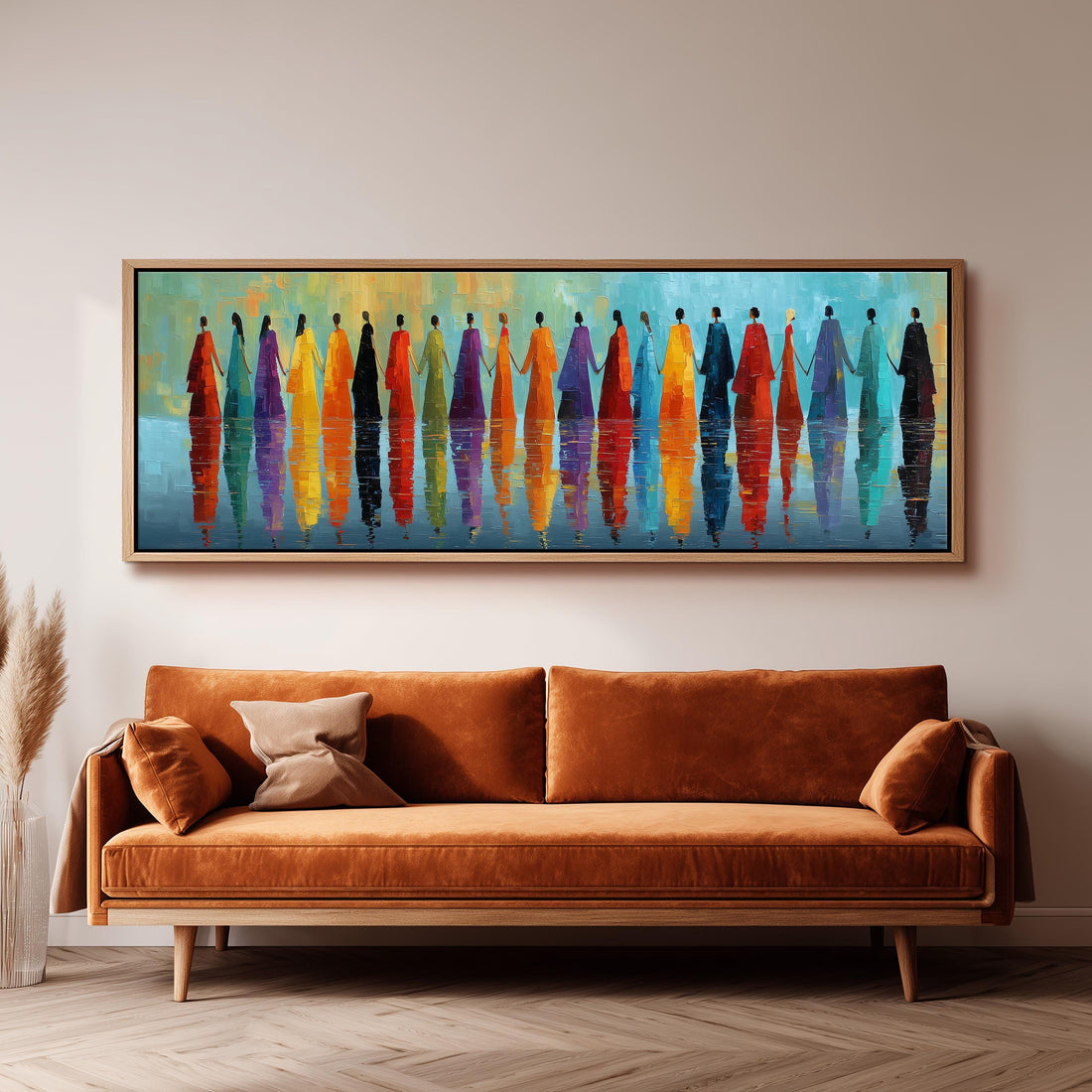 a large, colorful painting of people standing in a row, with their reflections visible in the water below. The painting is displayed on a wall above a brown sofa, creating a visually striking and vibrant atmosphere in the room.