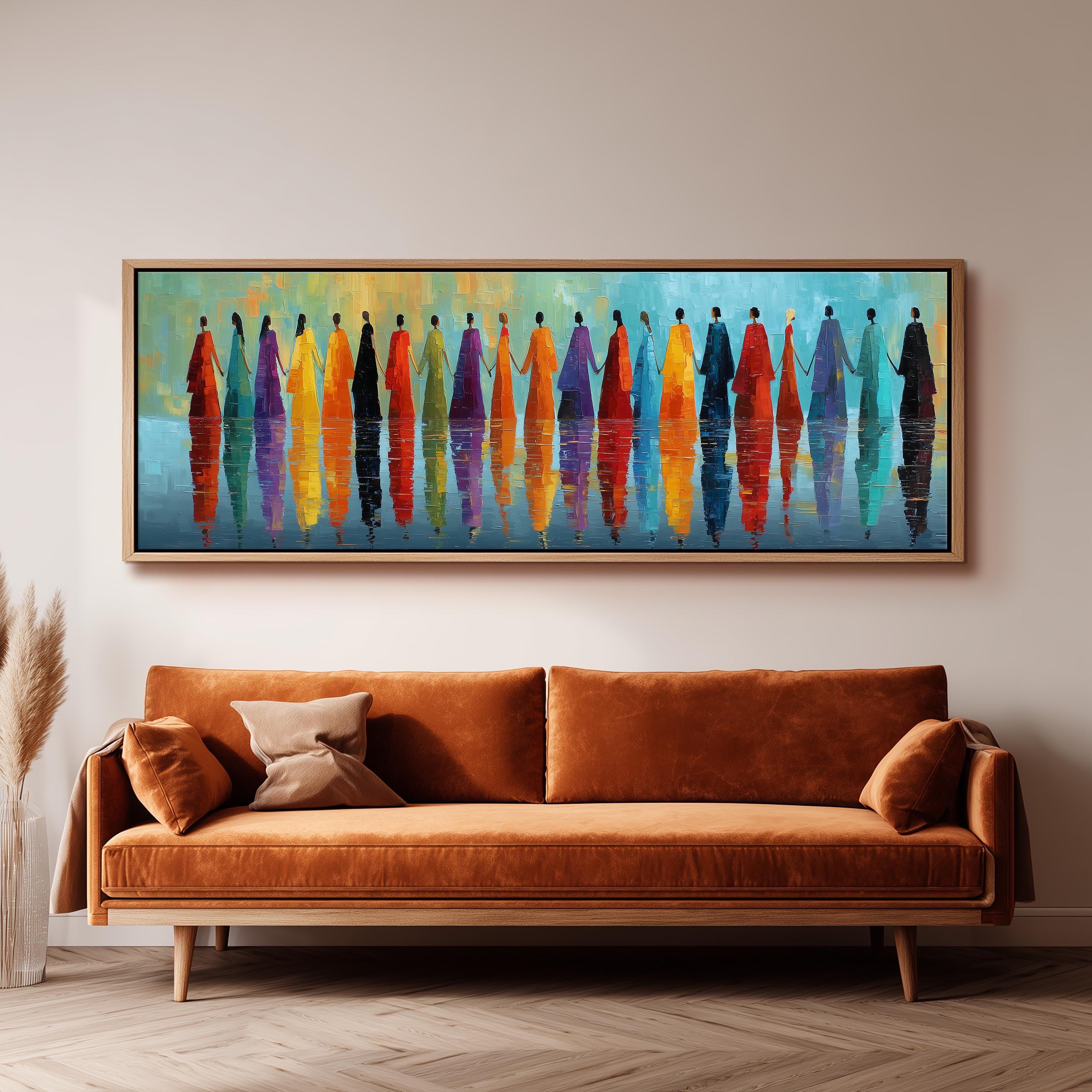 a large, colorful painting of people standing in a row, with their reflections visible in the water below. The painting is displayed on a wall above a brown sofa, creating a visually striking and vibrant atmosphere in the room.