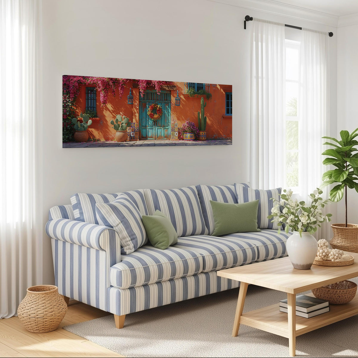 Adobe doorway with a wreath and cacti long horizontal canvas print above a striped sofa in a coastal living room