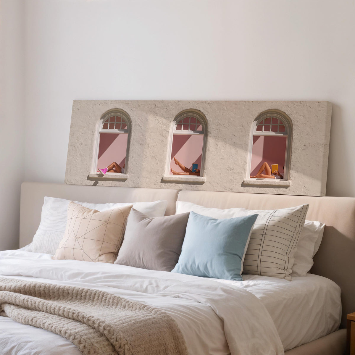 Women reading in three arched windows wide panoramic canvas print above a bed in a bedroom